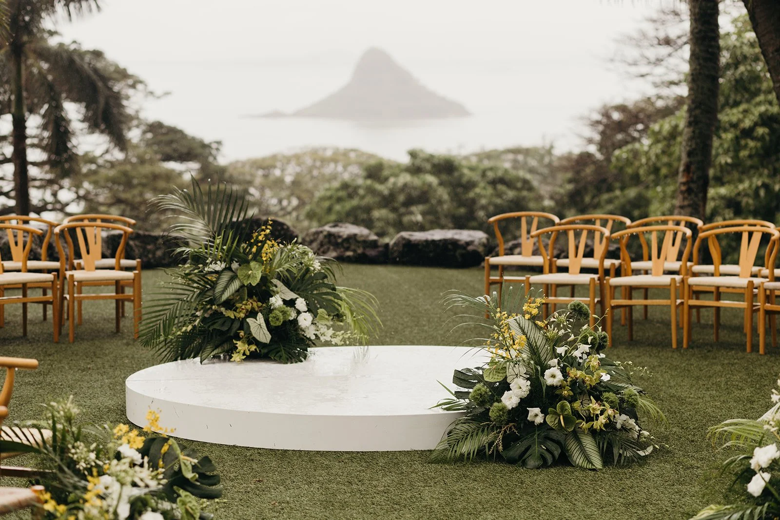 green white and yellow flowers at ceremony in hawaii