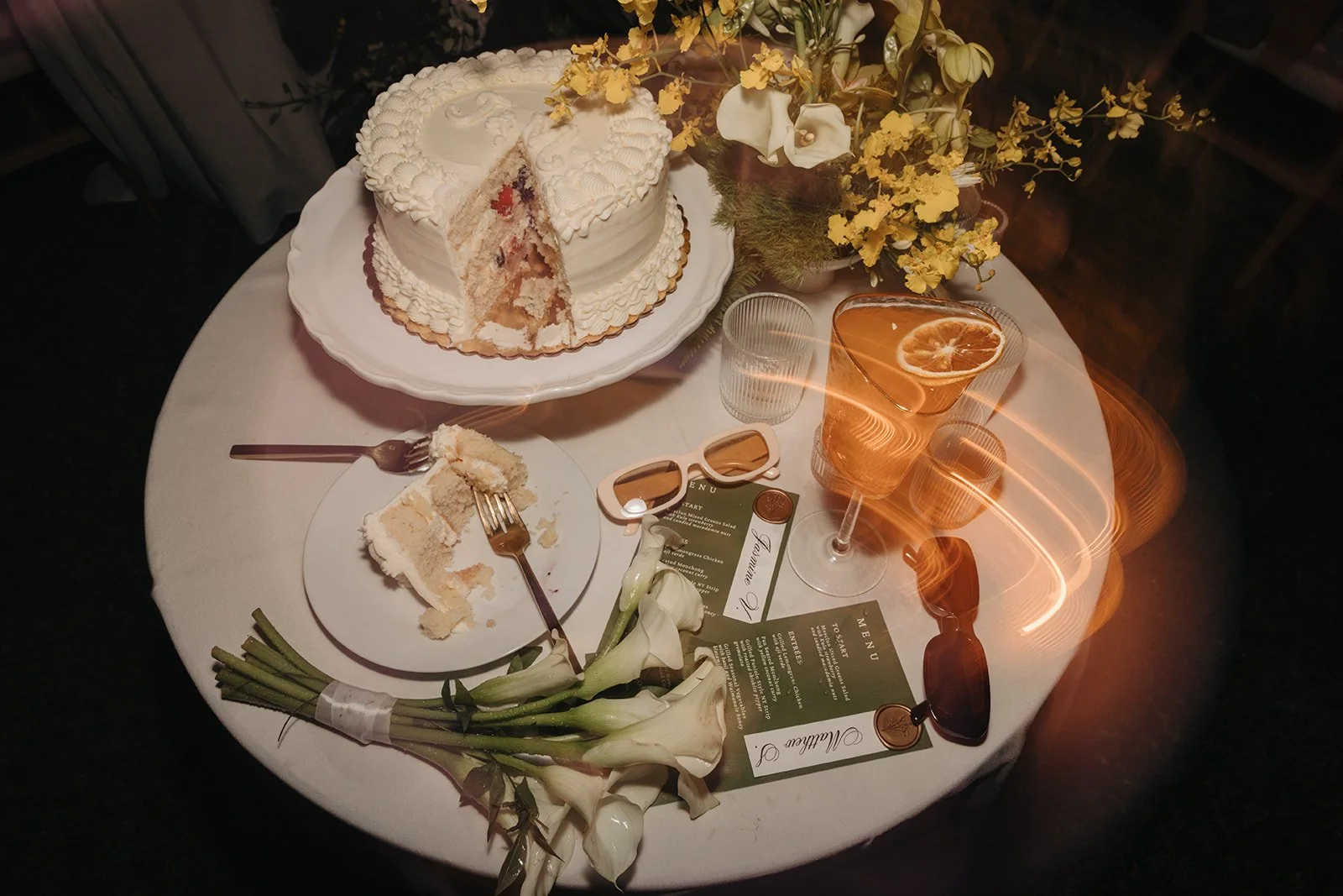 wedding cake with drink and bouquet
