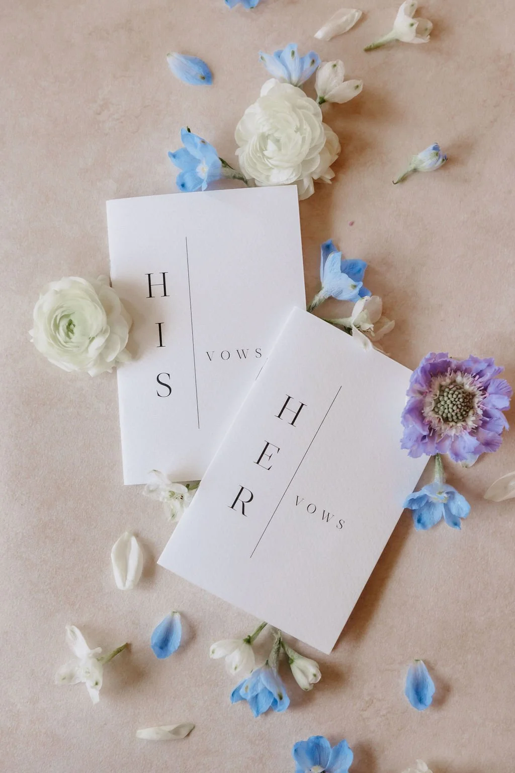 His and Hers wedding vow booklets styled for details photo.