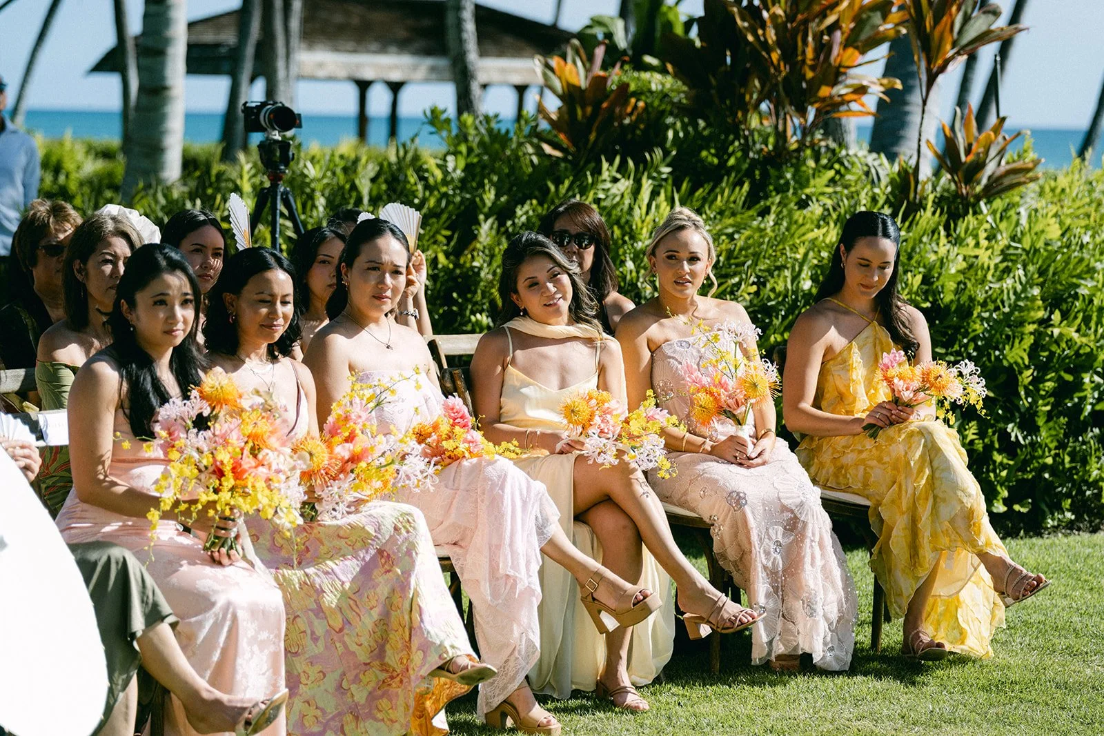 bridesmaids holding bouquets during ceremony