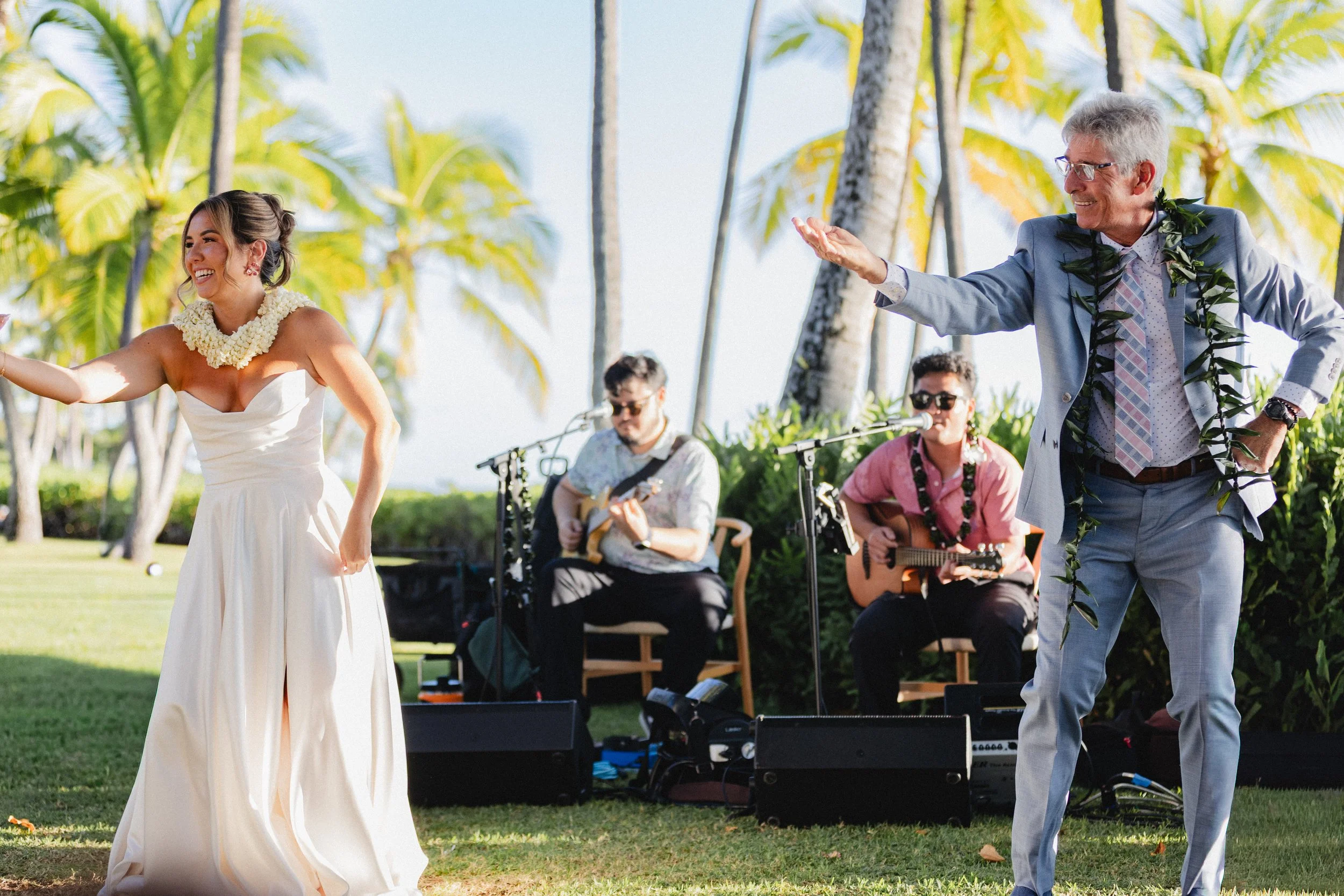 bride dancing hula with father