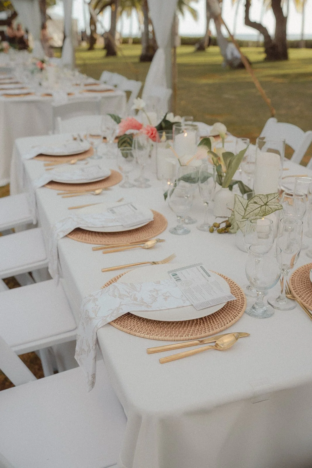 white tablescape with tropical flowers
