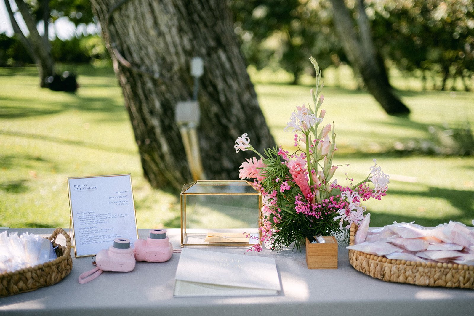 welcome table at wedding, with pink flowers