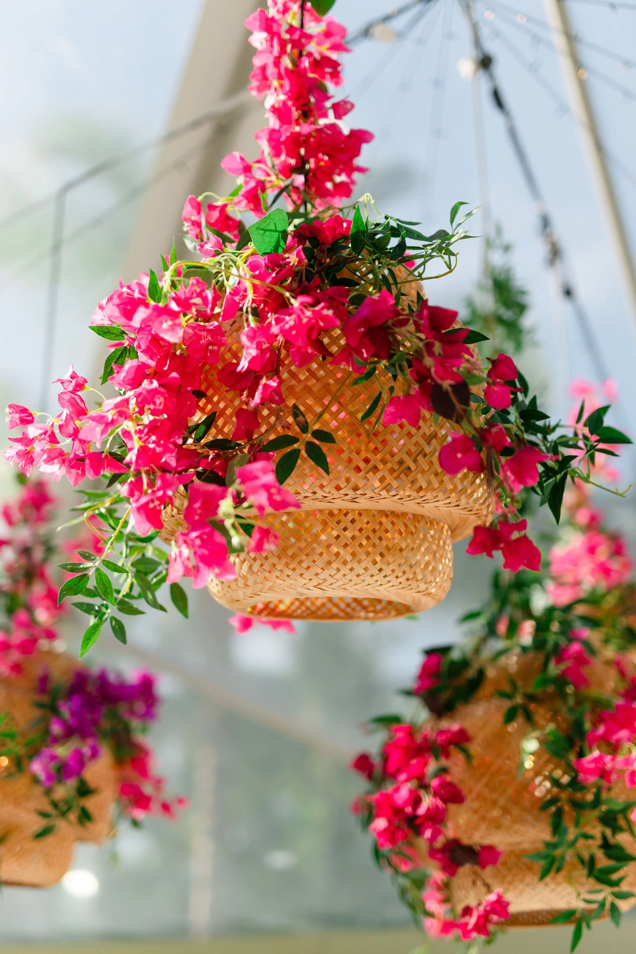 pink flowers rapped around rattan lantern