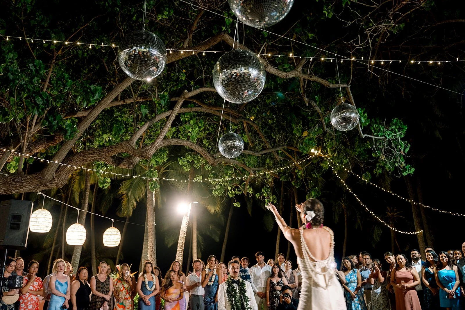 bride dancing hula under disco balls