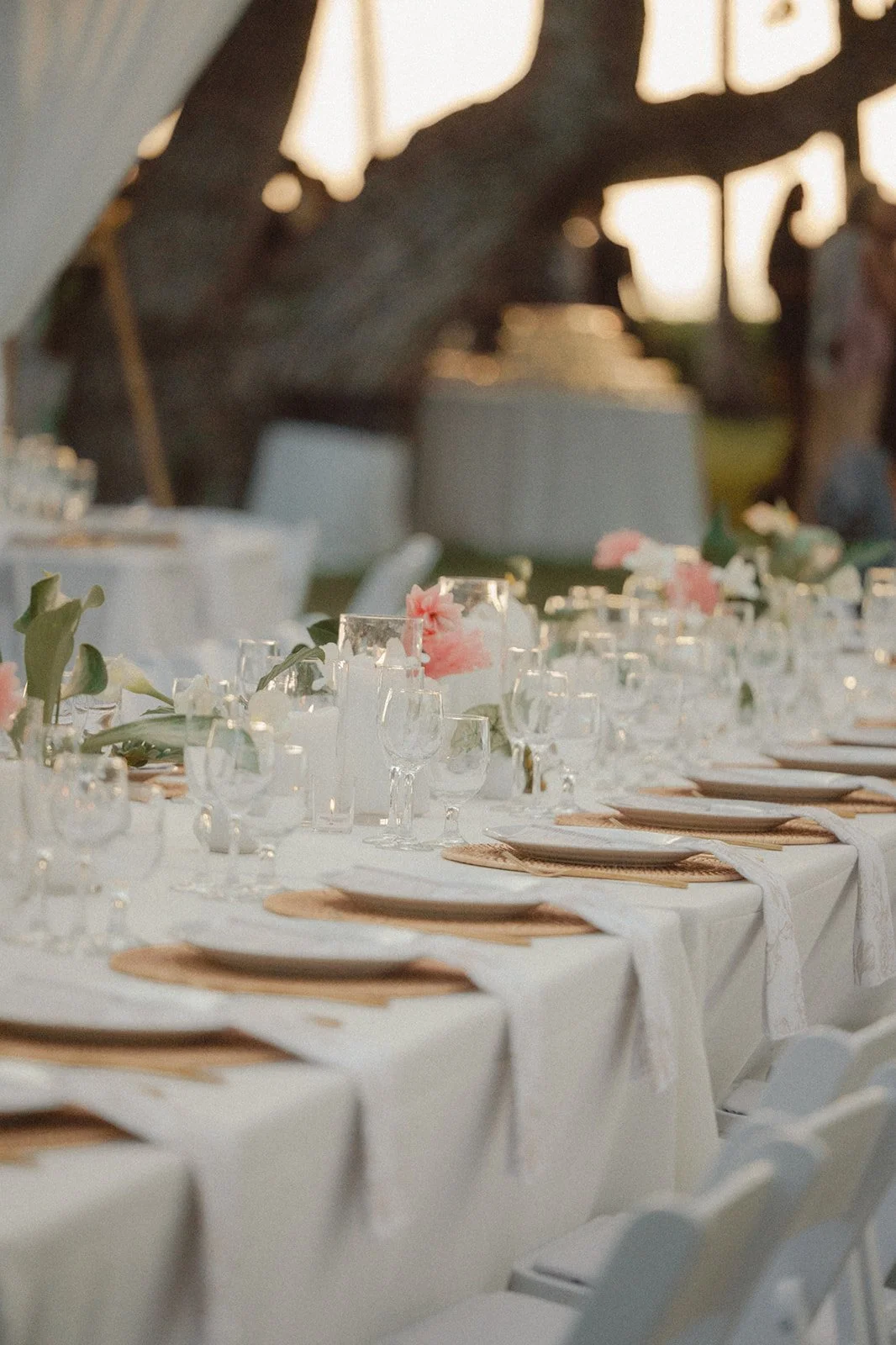 white tablescape with tropical flowers