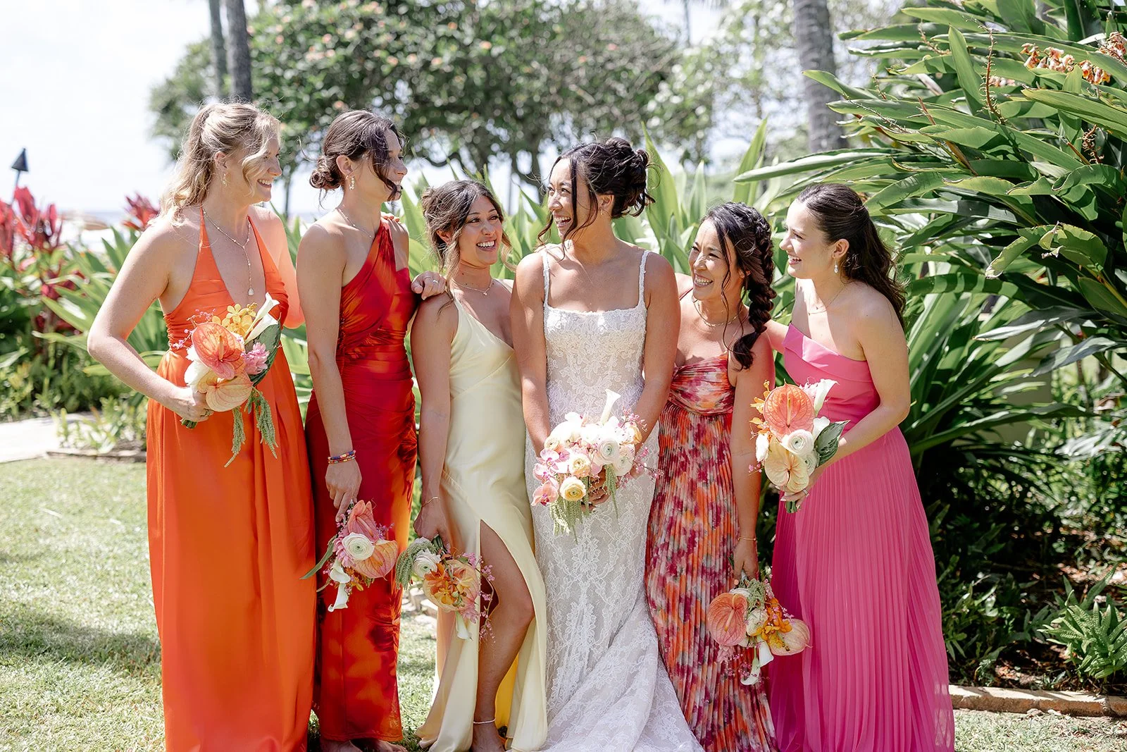 A joyful bride and her bridesmaids sharing smiles together