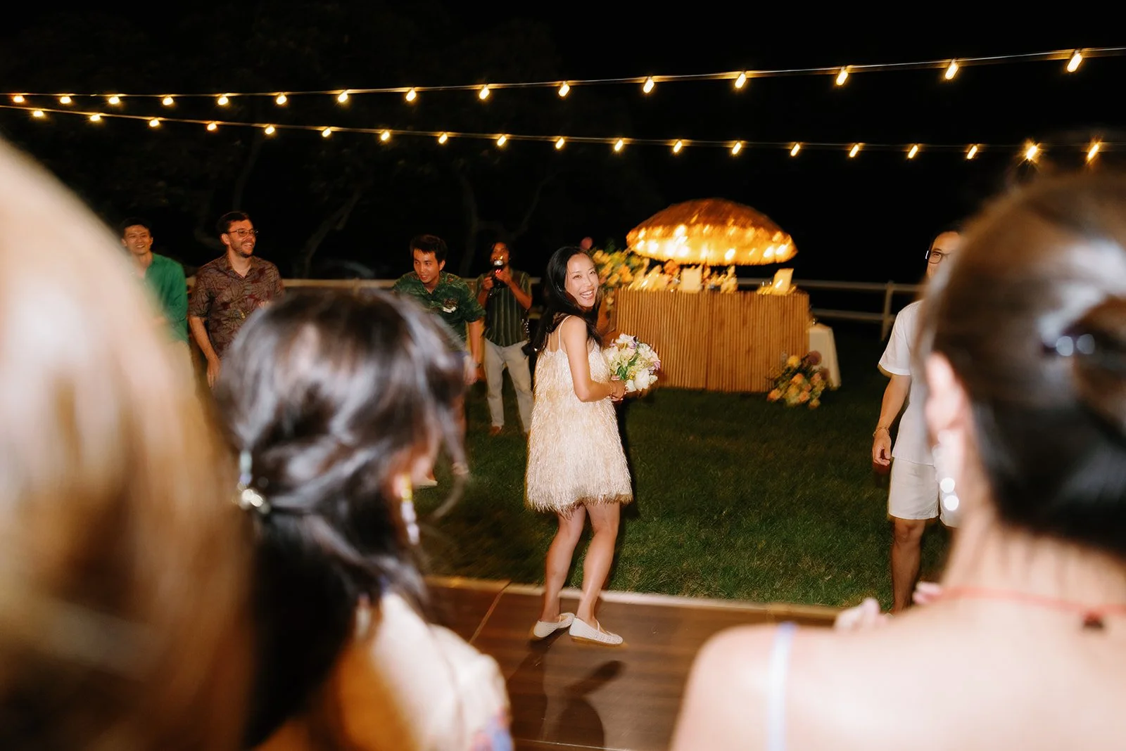 Bride gets ready for bouquet toss
