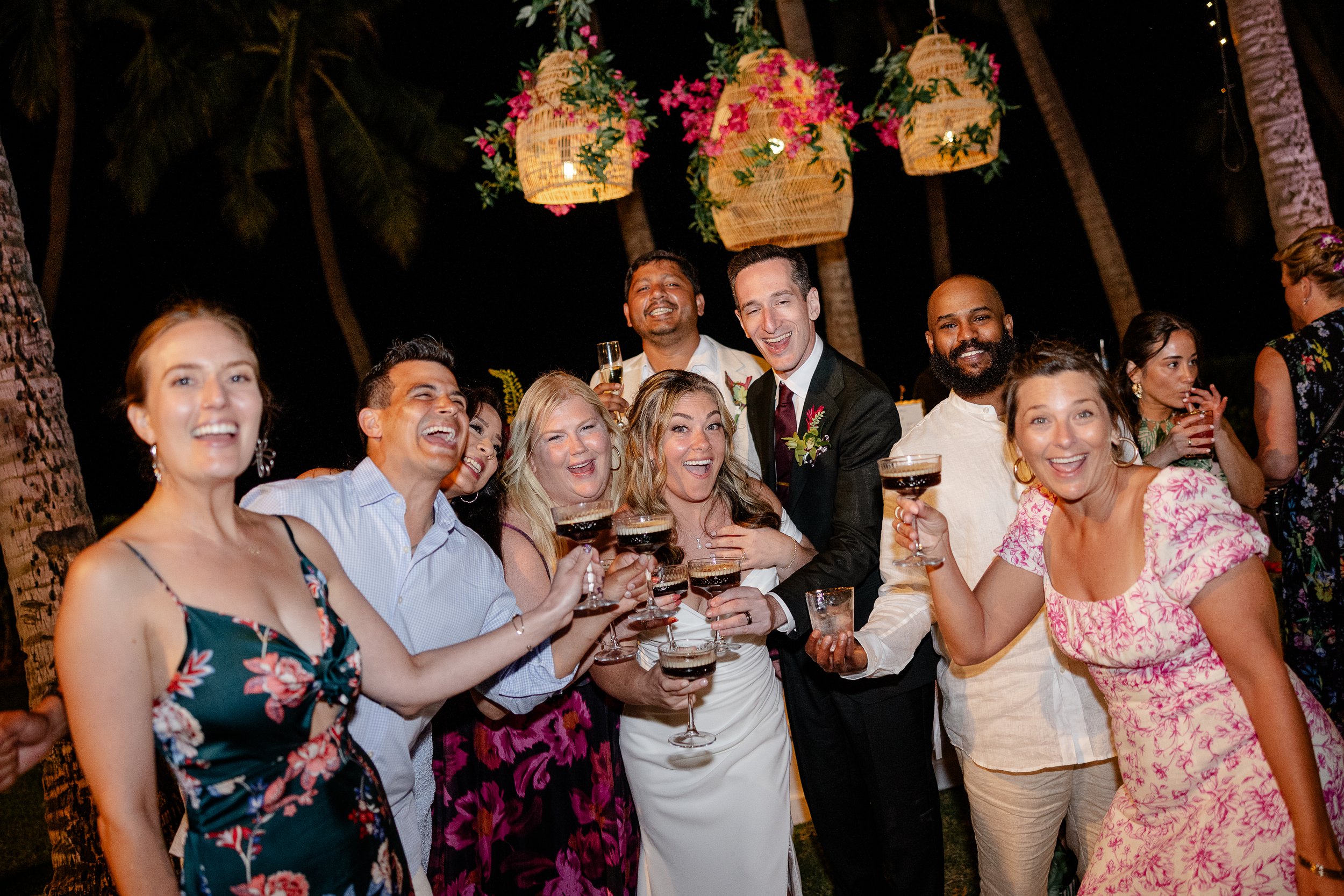 bride and groom with guests holding espresso martinis