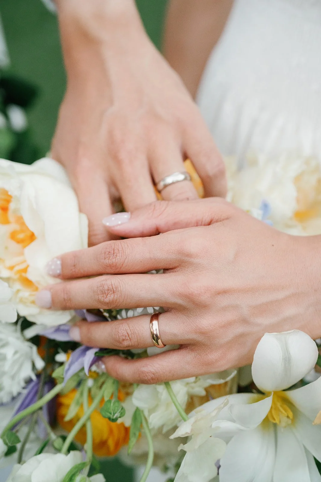 Detail shot of bride and groom wedding rings