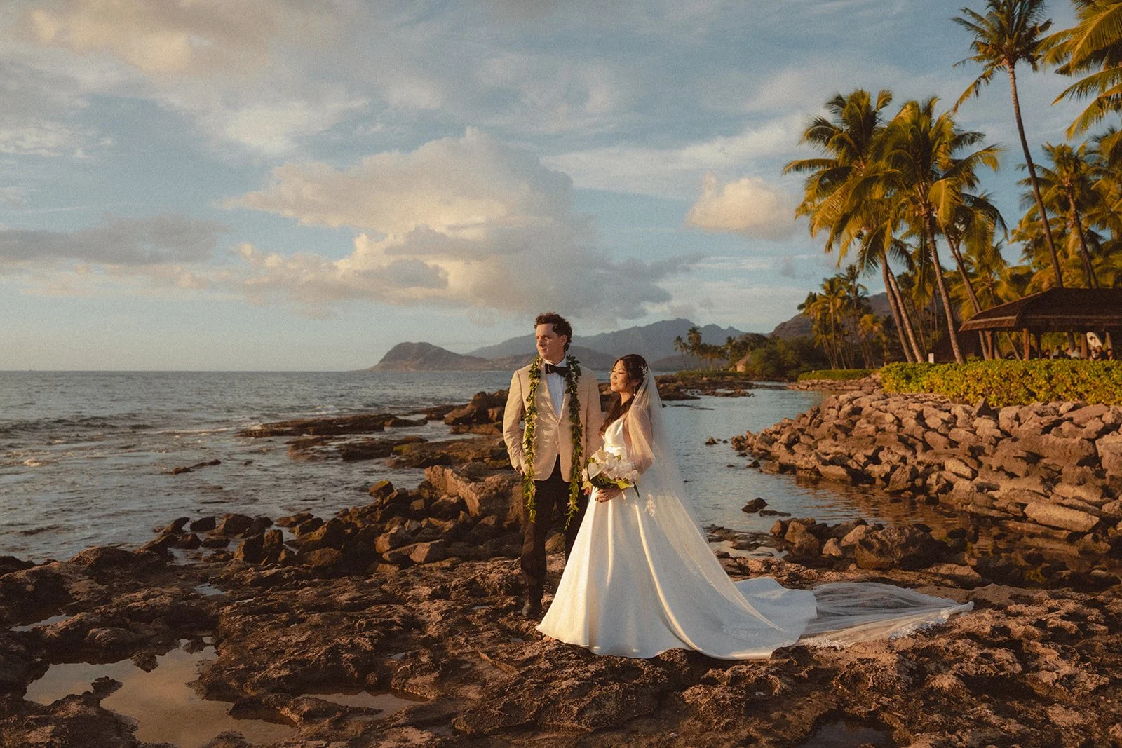 bride and groom on beach in hawaii