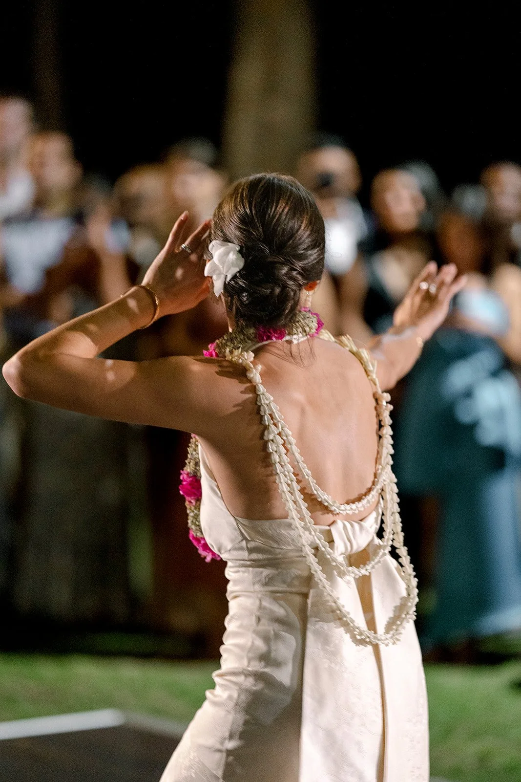 bride dancing hula wearing lei