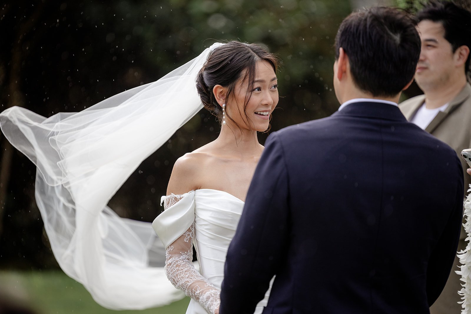 bride and groom in the rain in hawaii