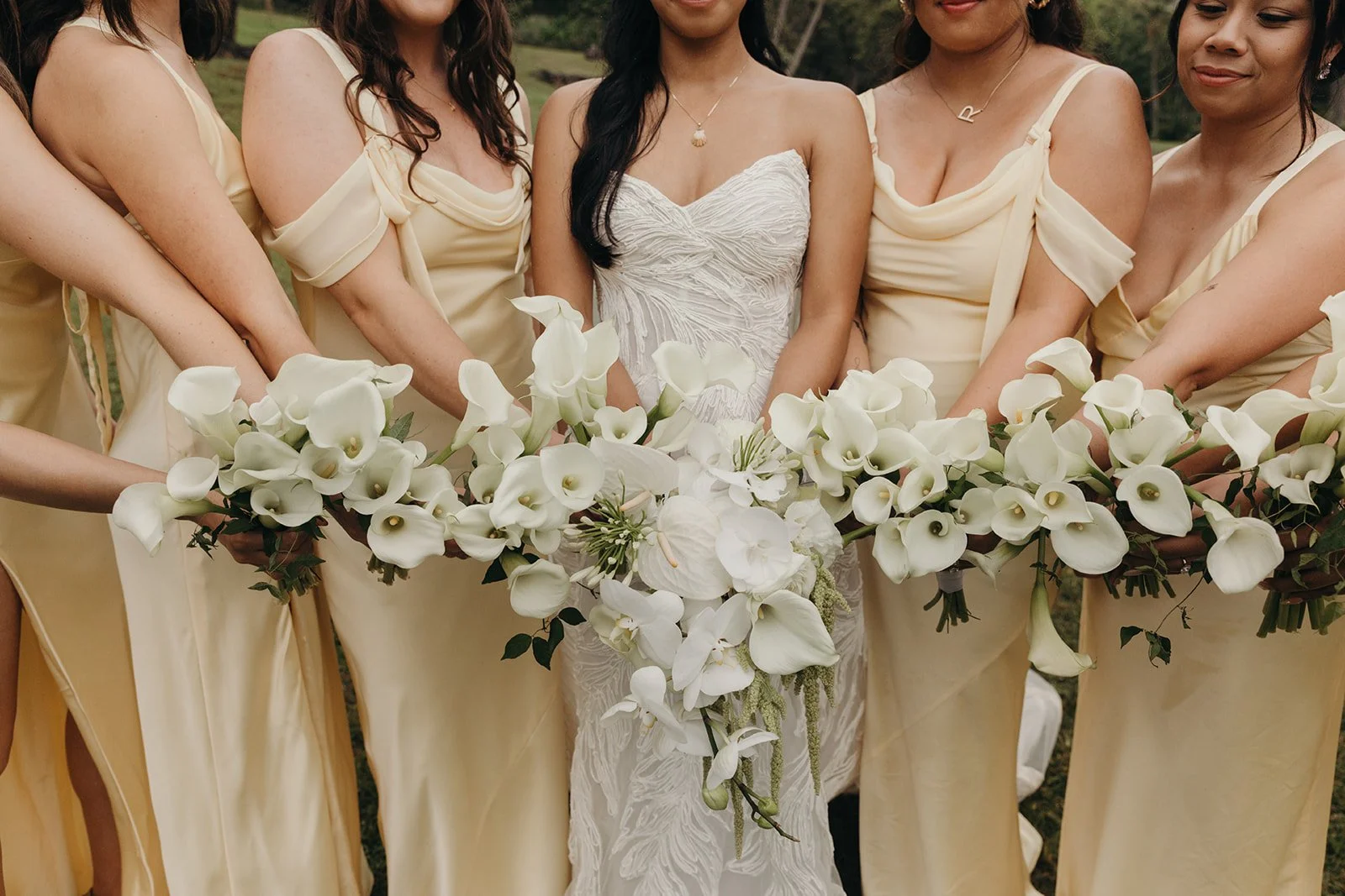 white lily bouquets with yellow bridesmaid dresses