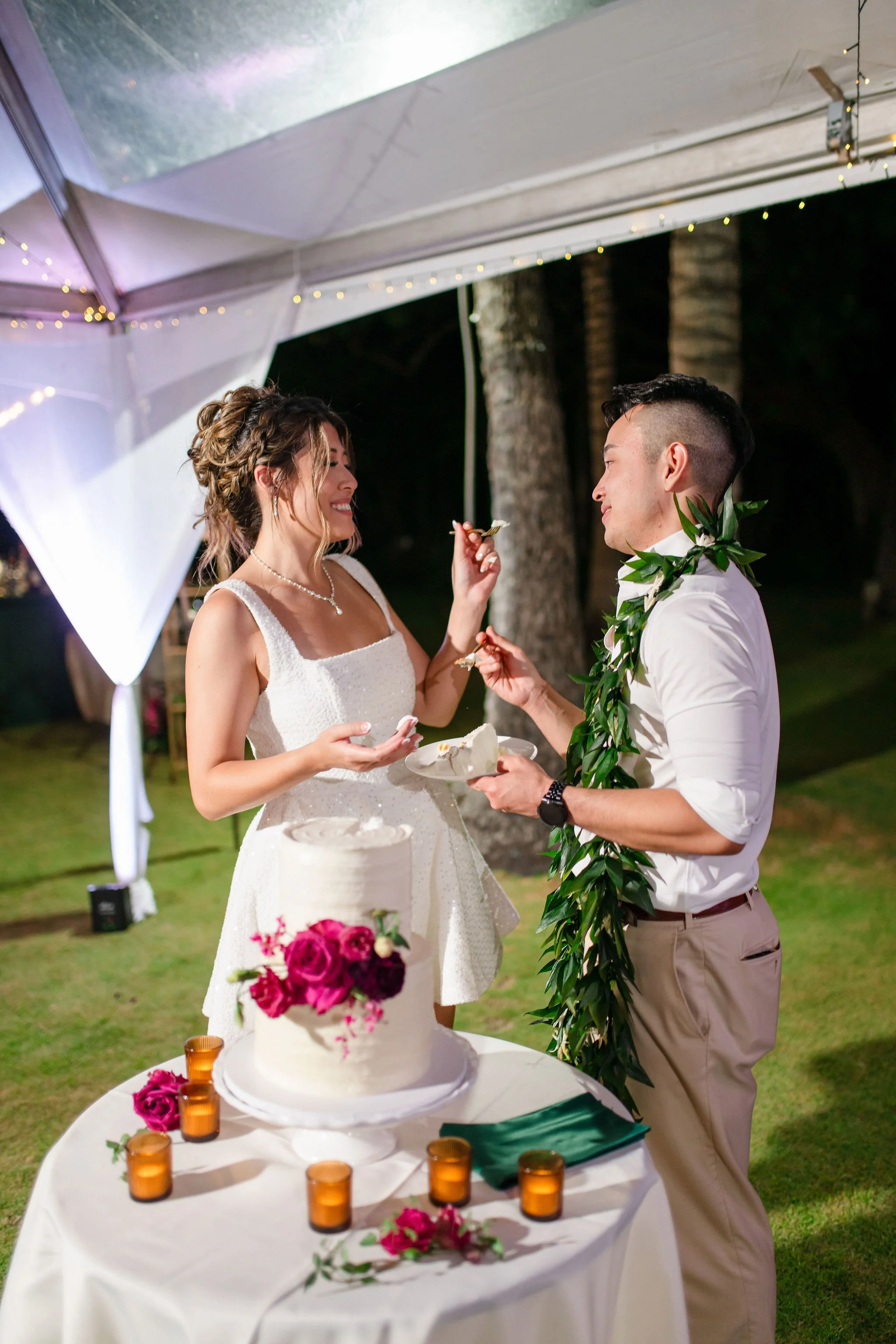 bride and groom cutting cake