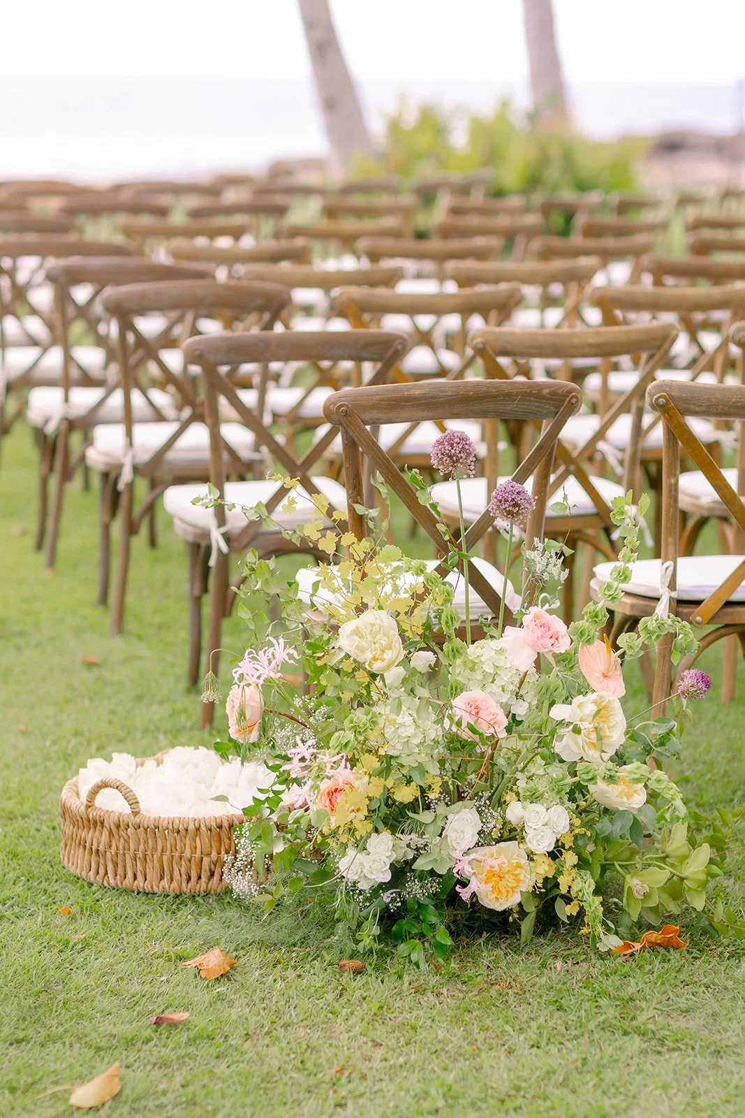 pastel flower arrangment at the beginning of aisle
