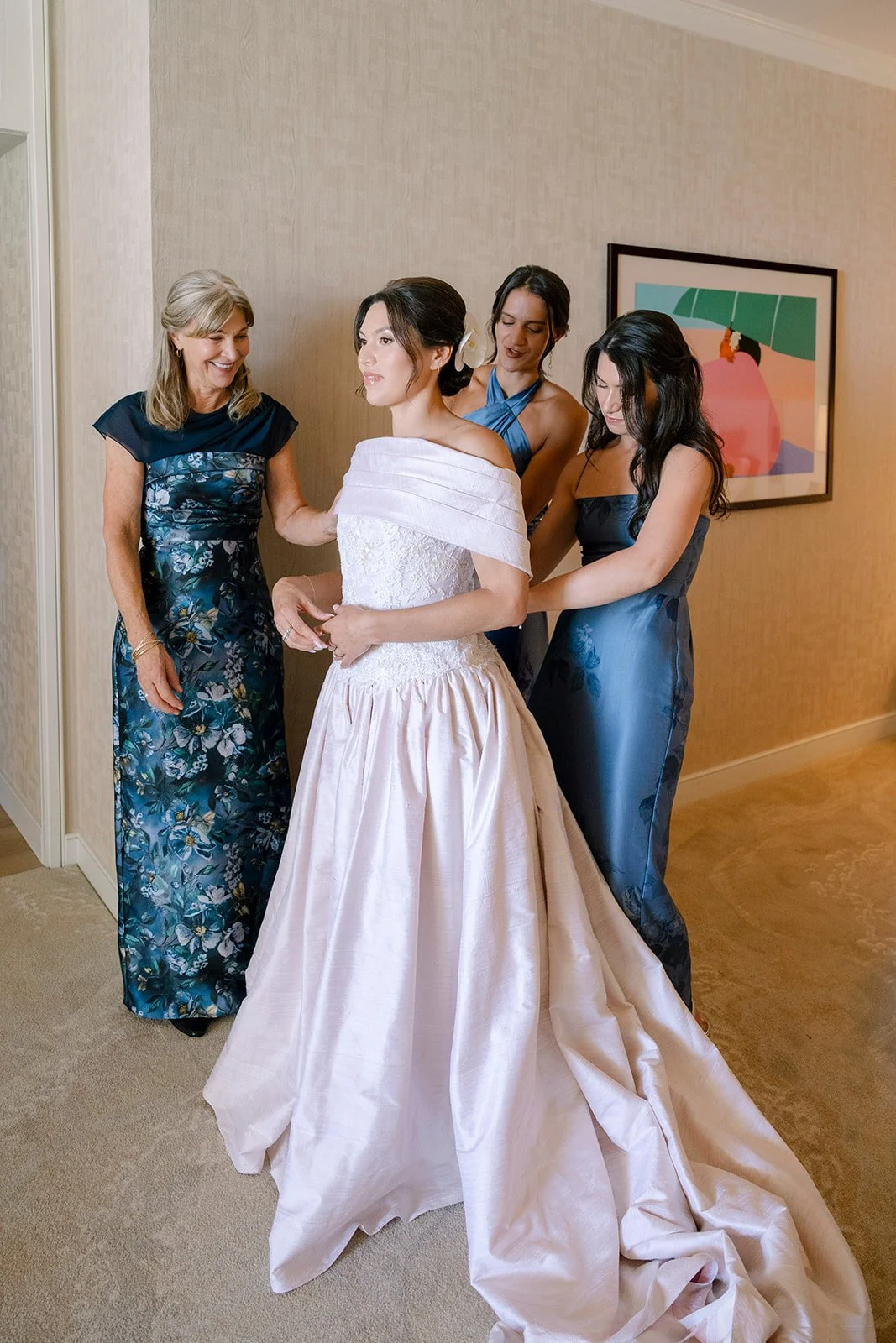bride with bridesmaids in navy dresses