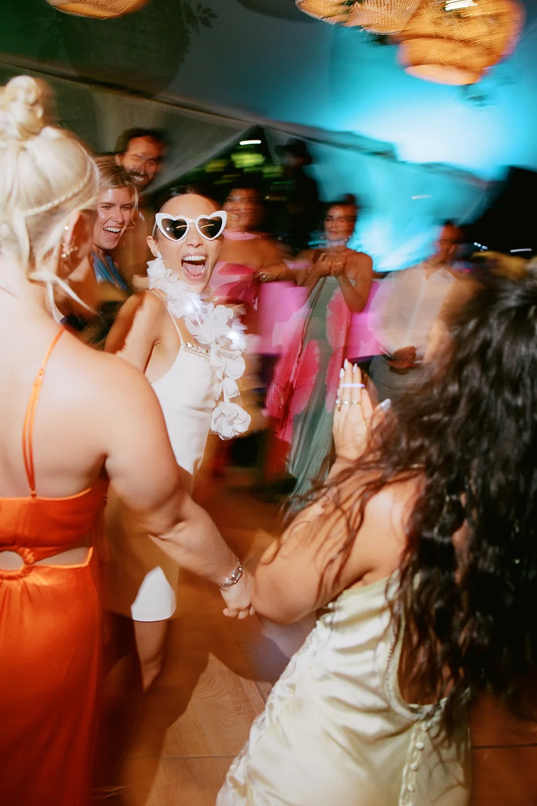 bride with heart shaped glasses on dance floor