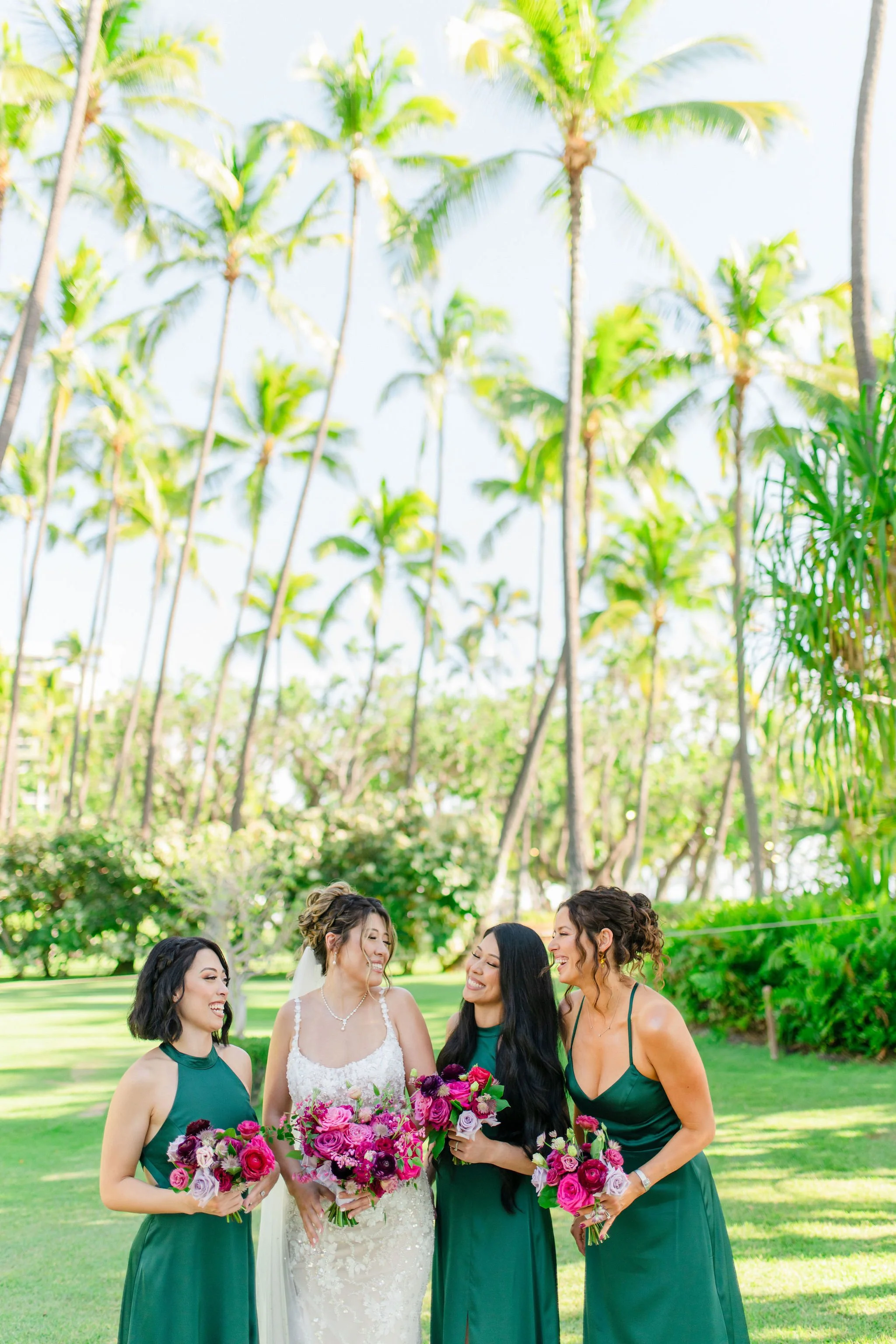 bride with bridesmaids at wedding in hawaii