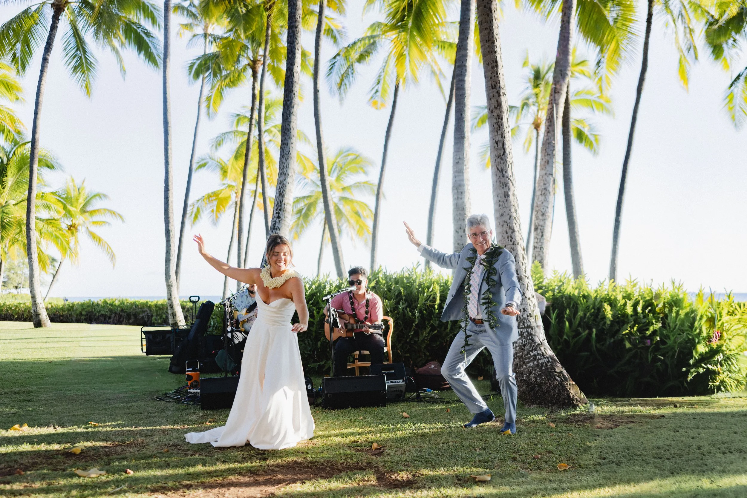 bride dancing hula with father