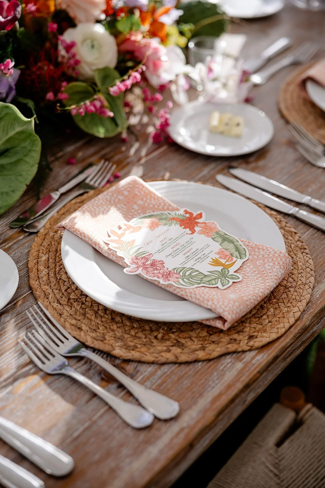 guest table at wedding with tropical decor