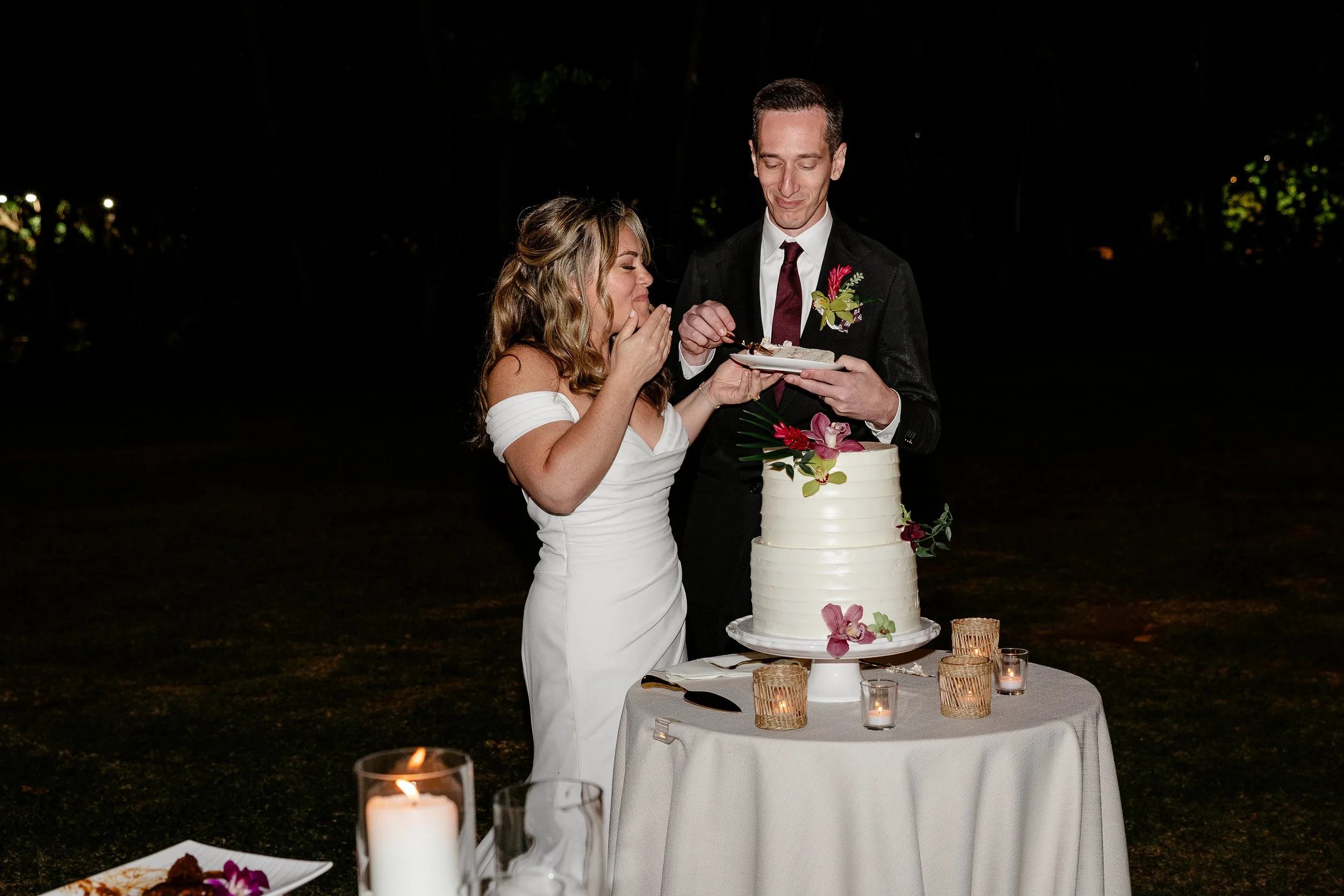 bride and groom eating cake