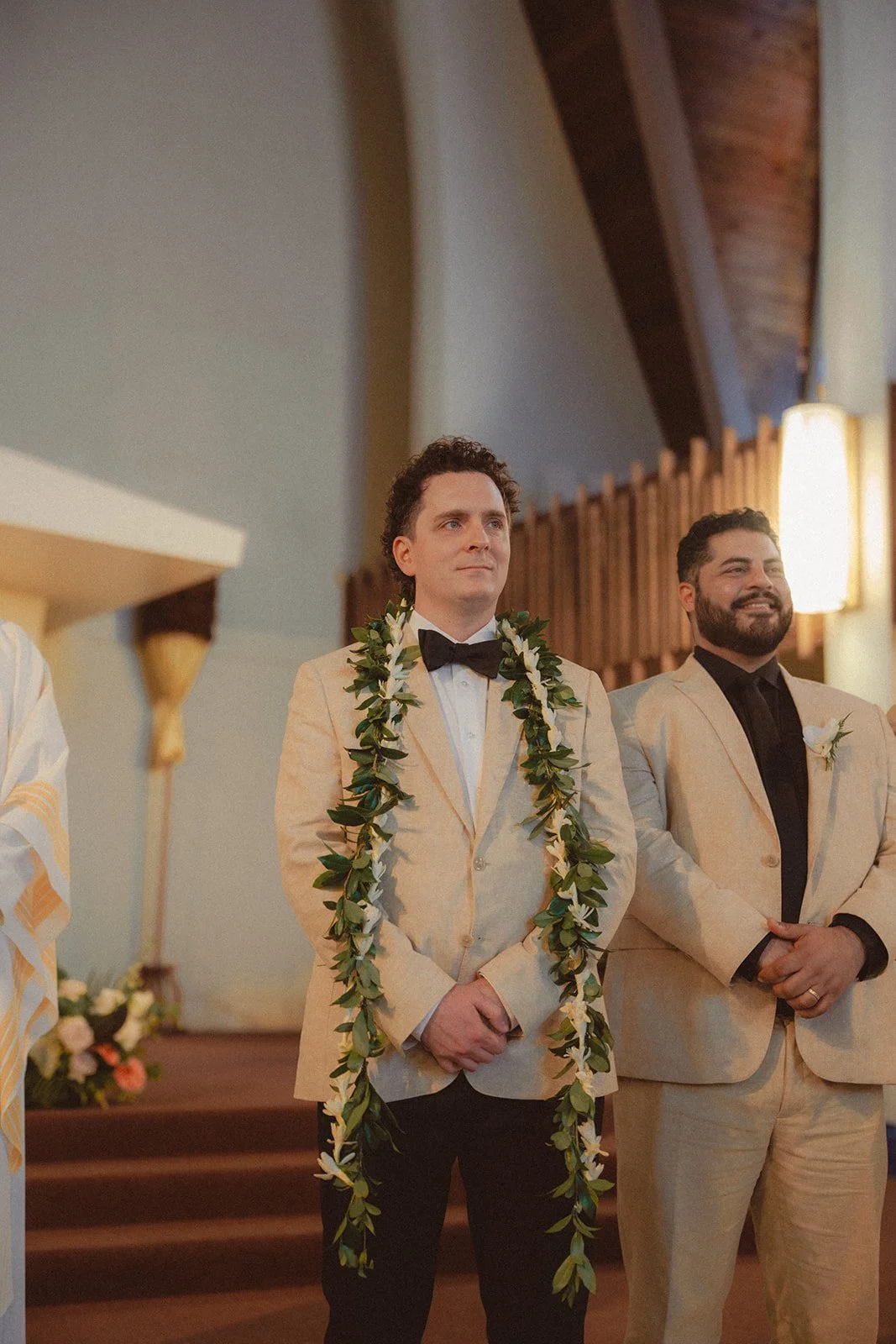 groom in tan tux with lei
