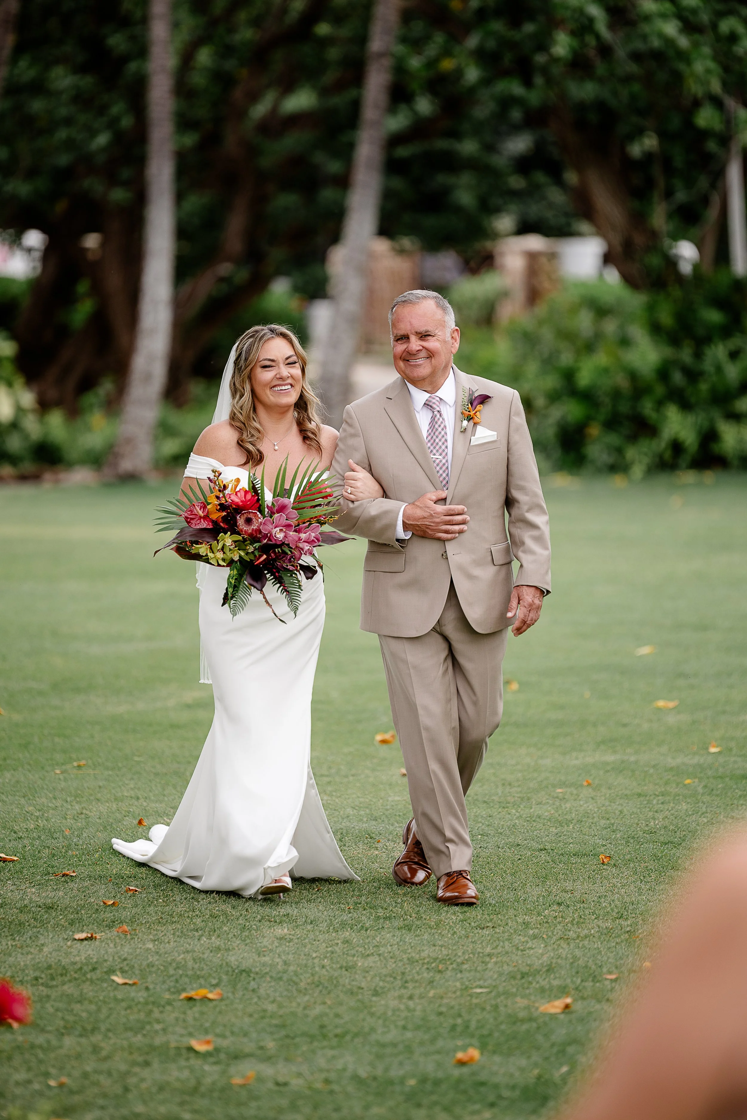 bride walking down aisle in Hawai'i with dad