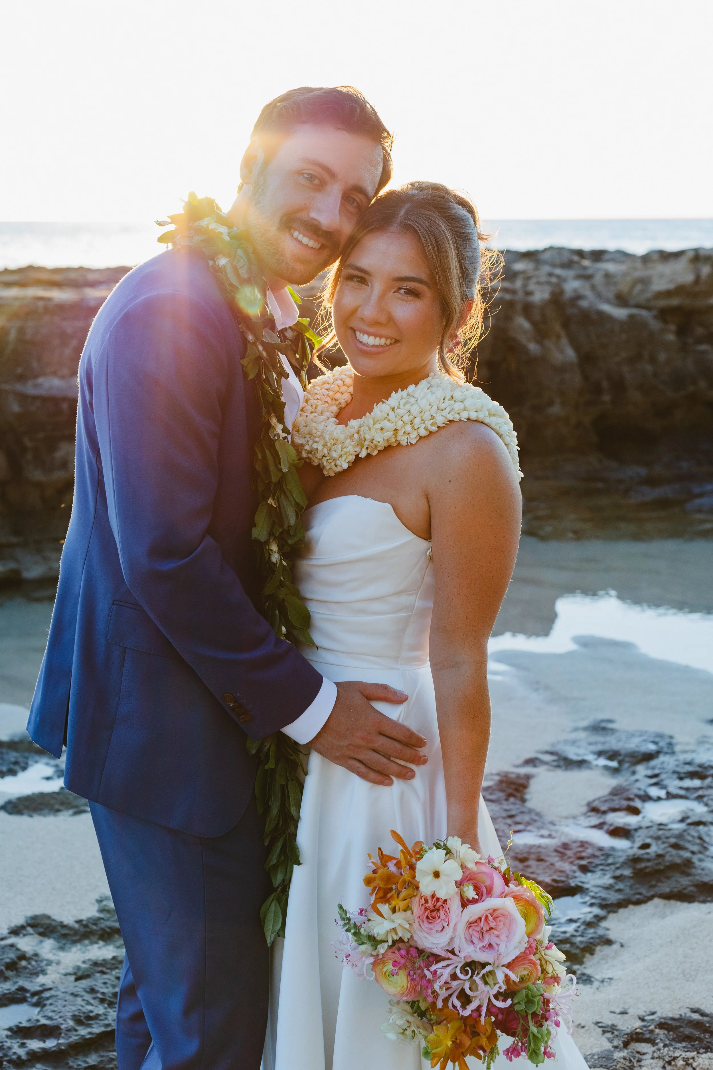 bride and groom on beach in hawaii