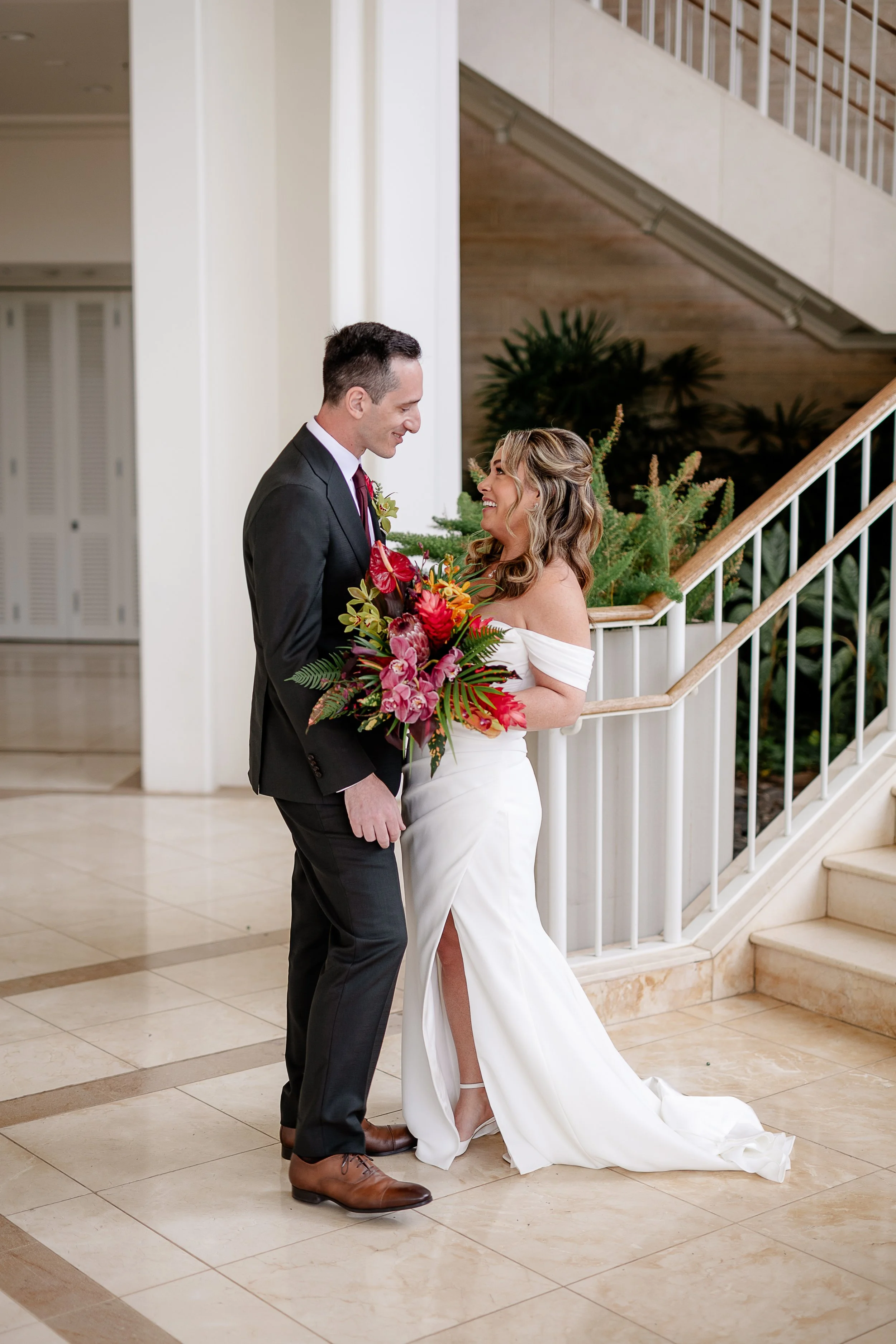 bride and groom first looks with tropical bouquet in Hawai'i