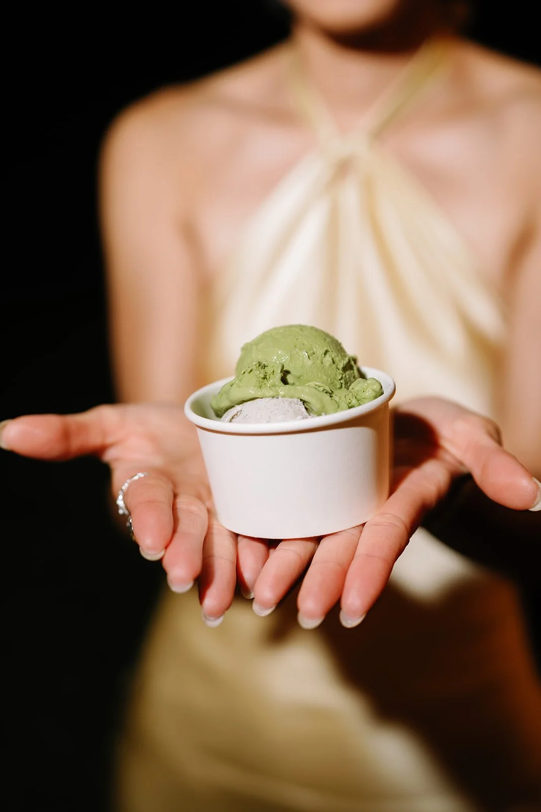 Guest posing with a cup of gelato