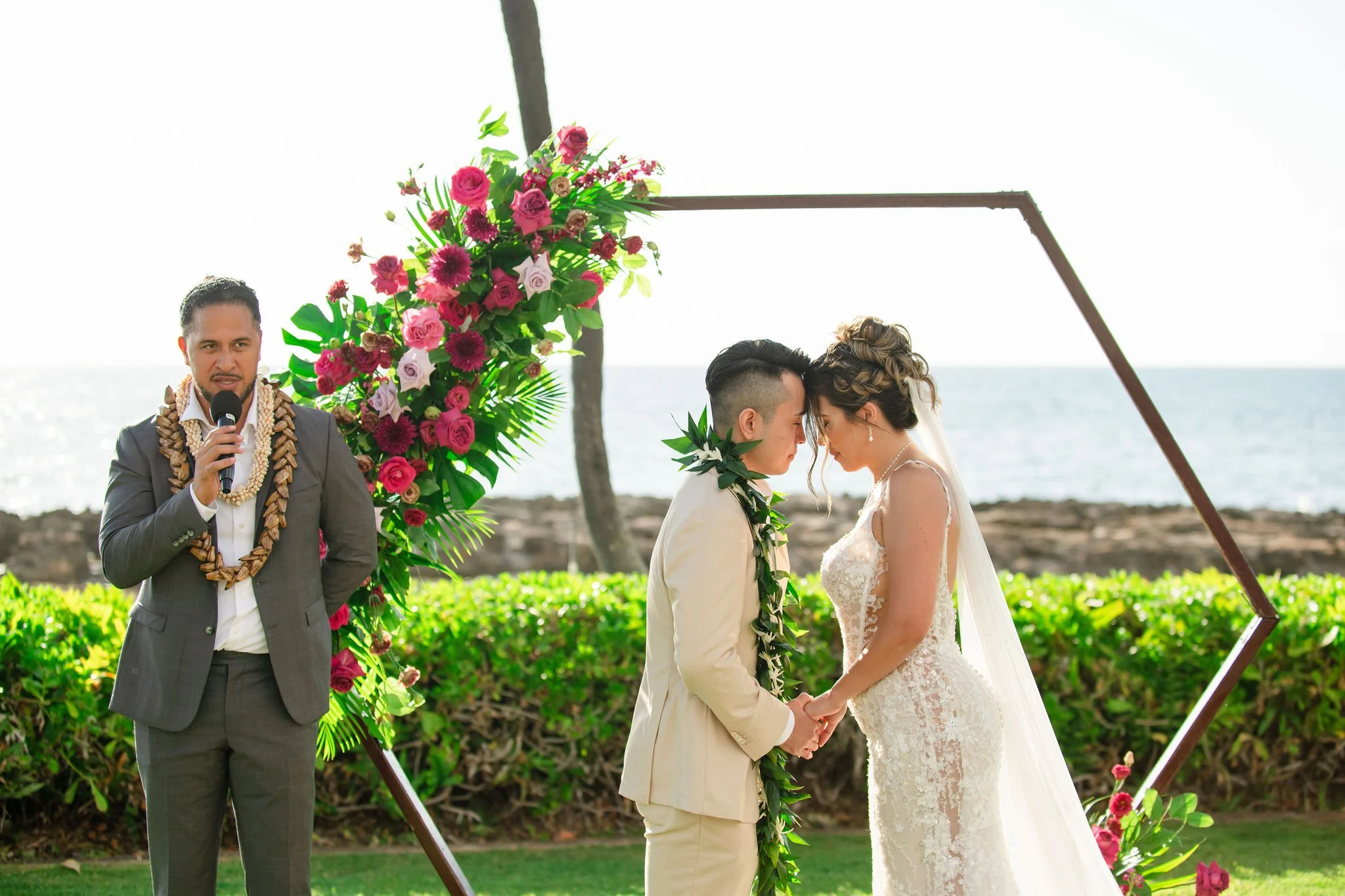 bride and groom embracing each other during ceremony in hawaii