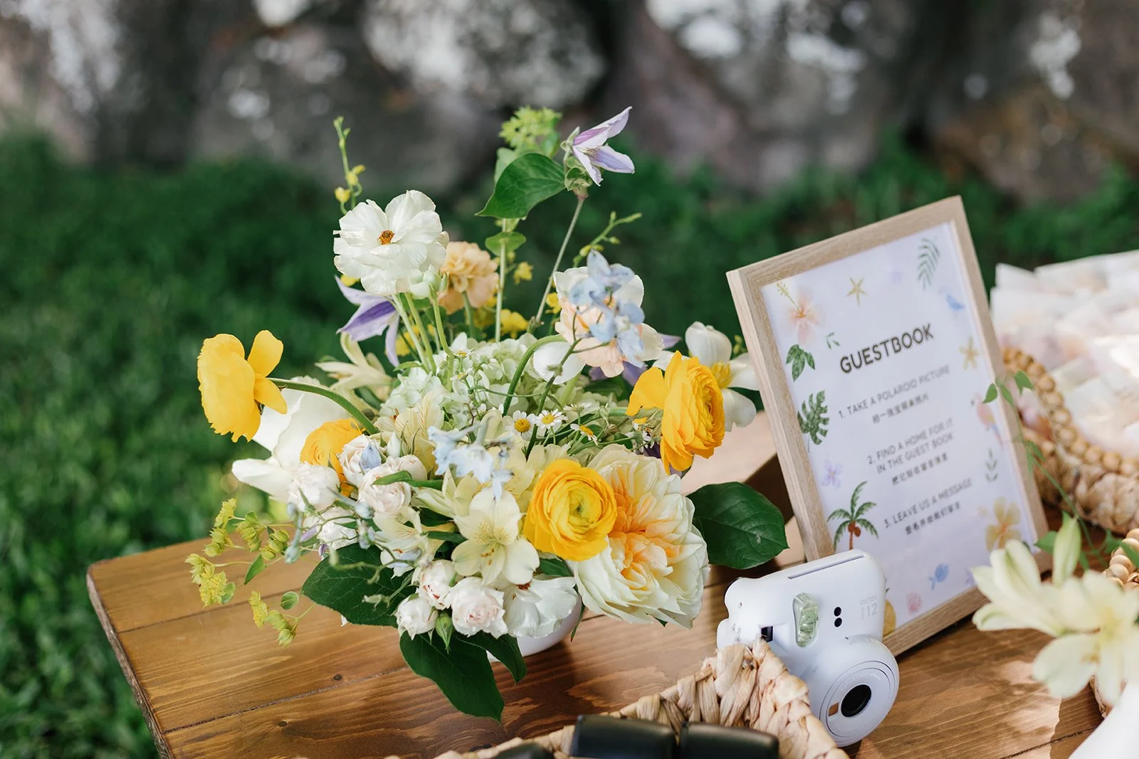 Guest table with small flower arrangement and guestbook for guests to sign