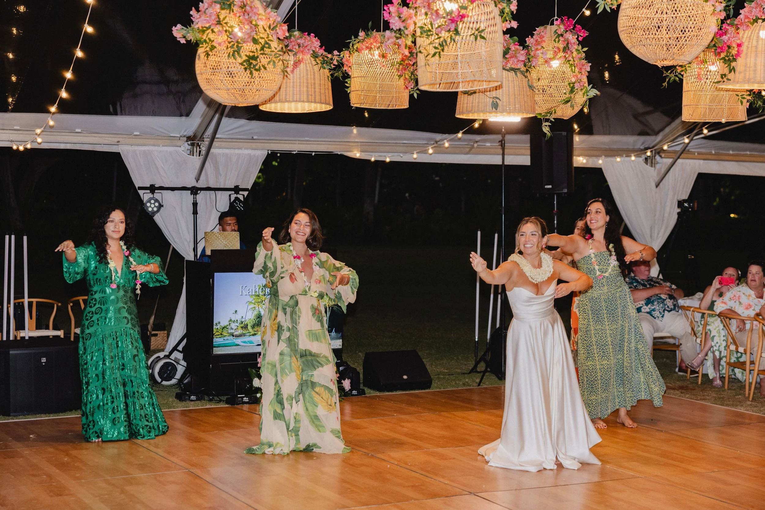 bride dancing hula with family