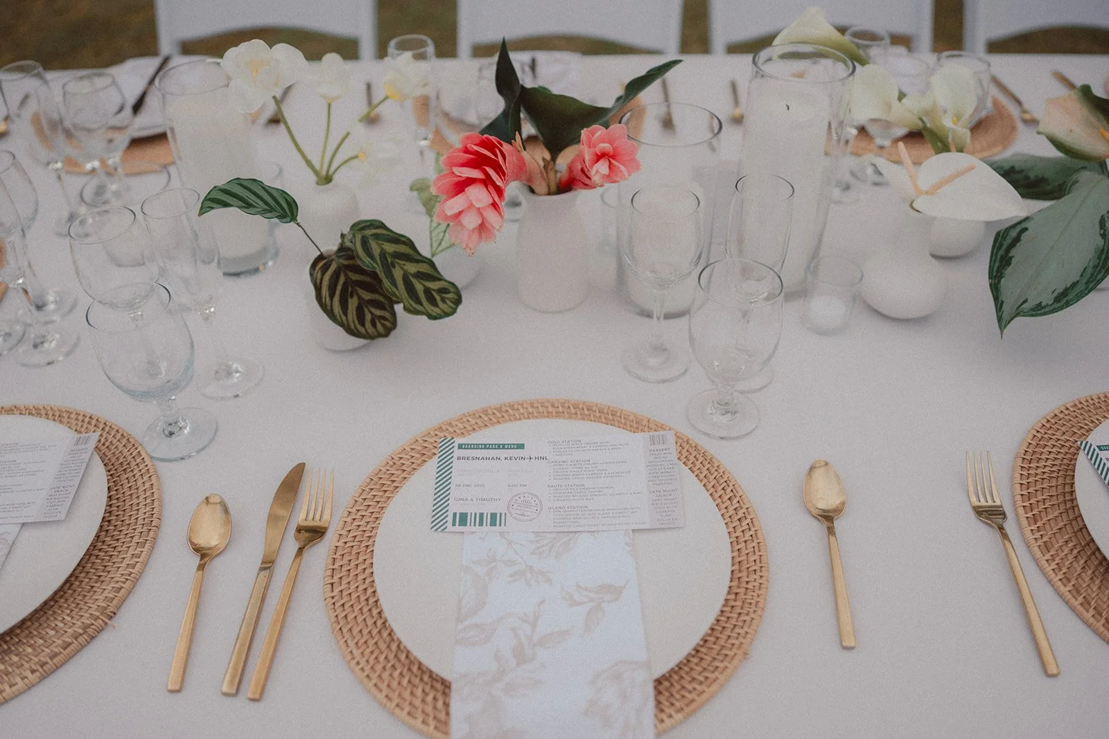 white tablescape with tropical flowers