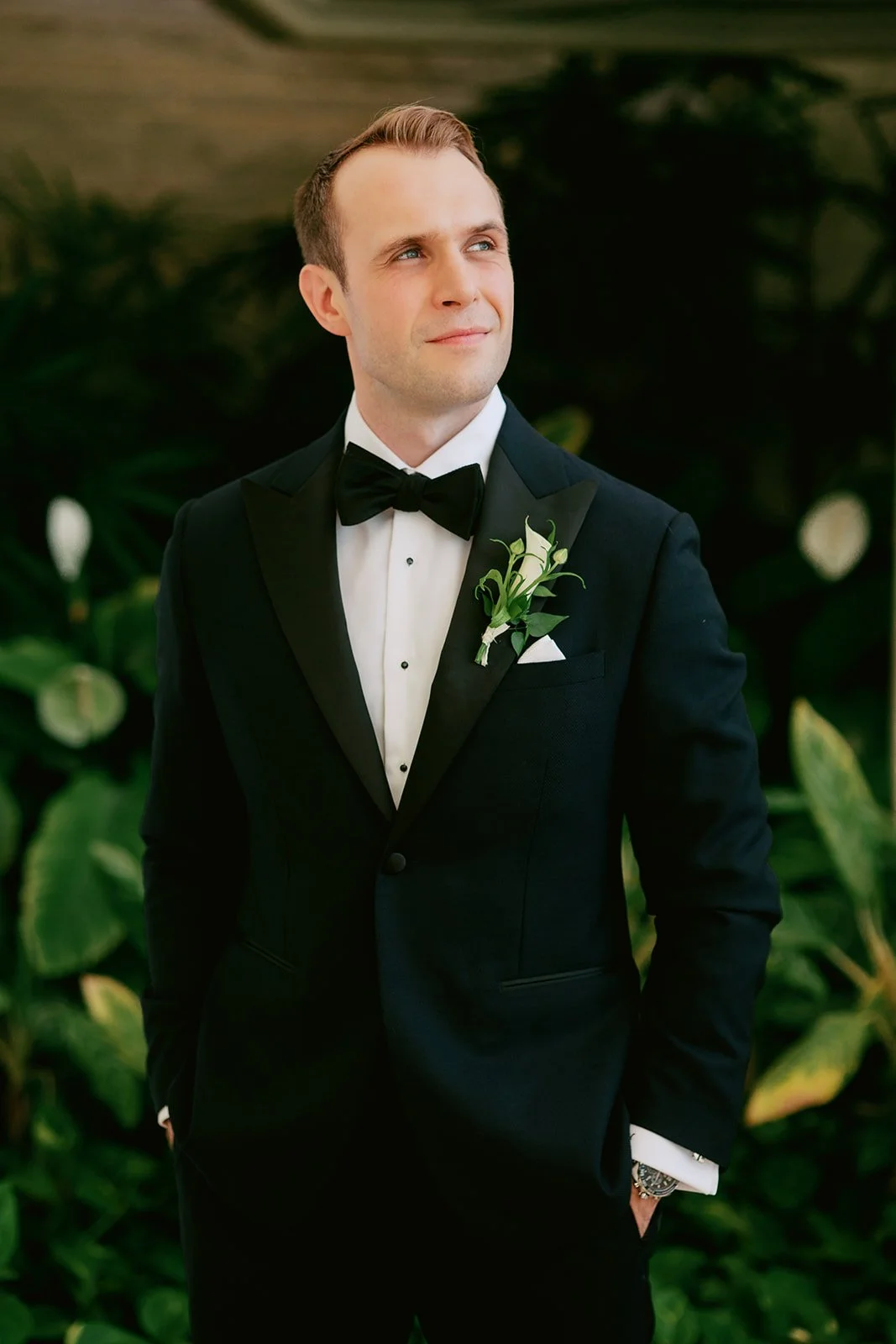 groom in black suit