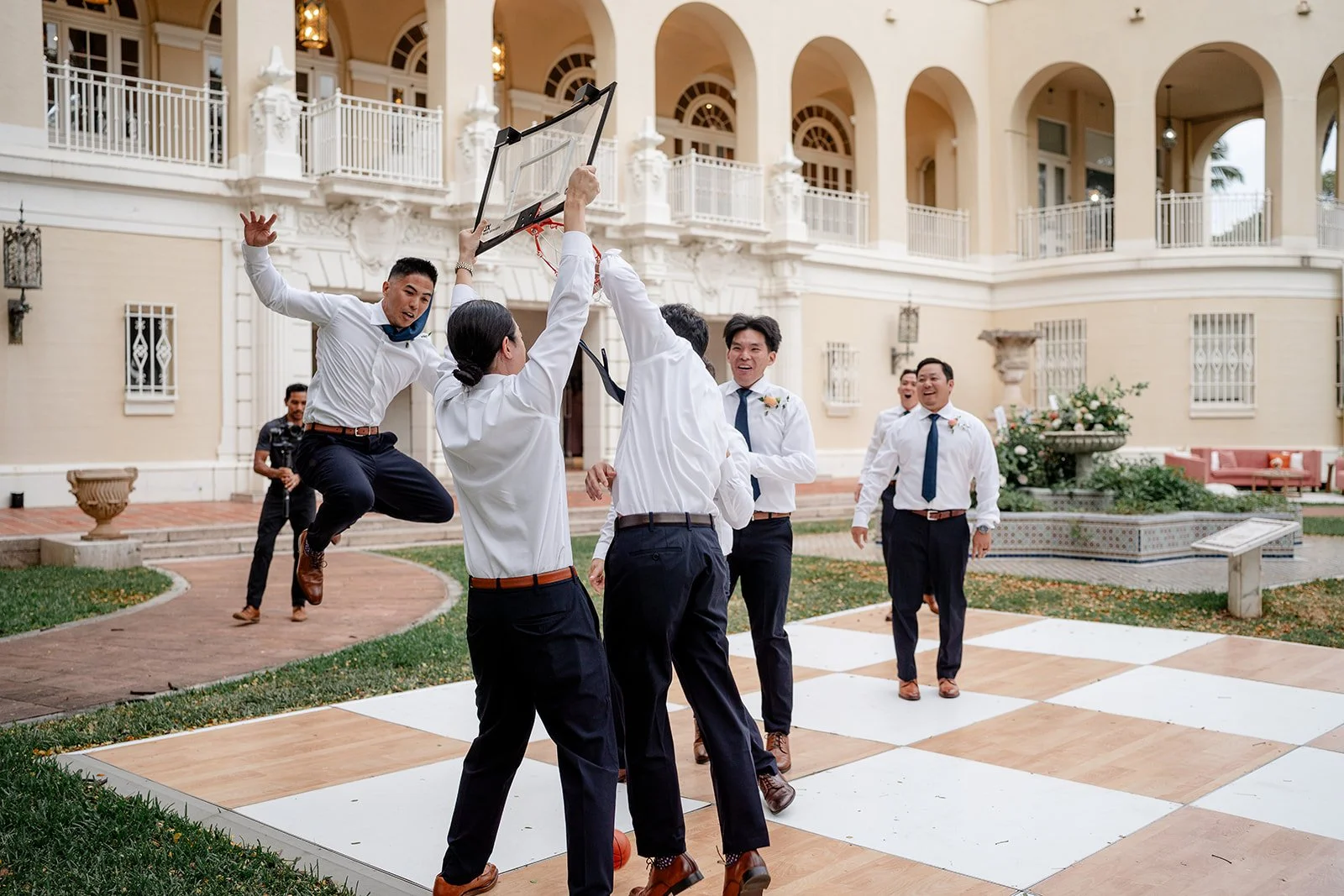 groomsmen on dance floor with basketball hoop