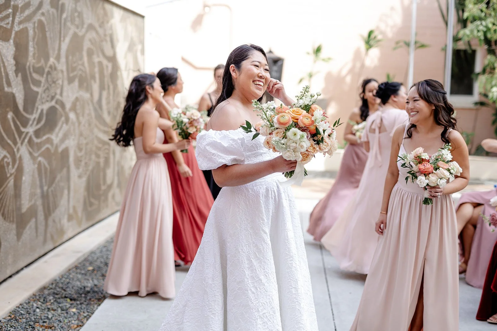 bride and bridesmaids in mauve dresses