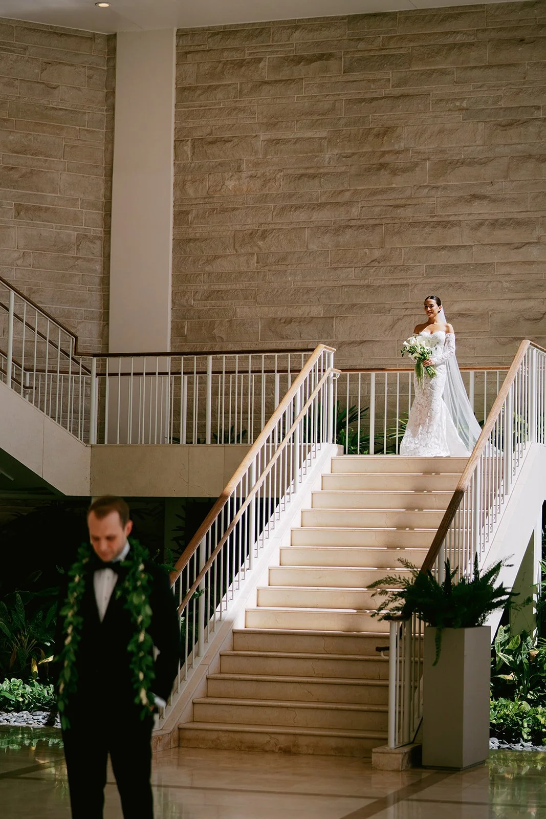bride and groom first look on staircase
