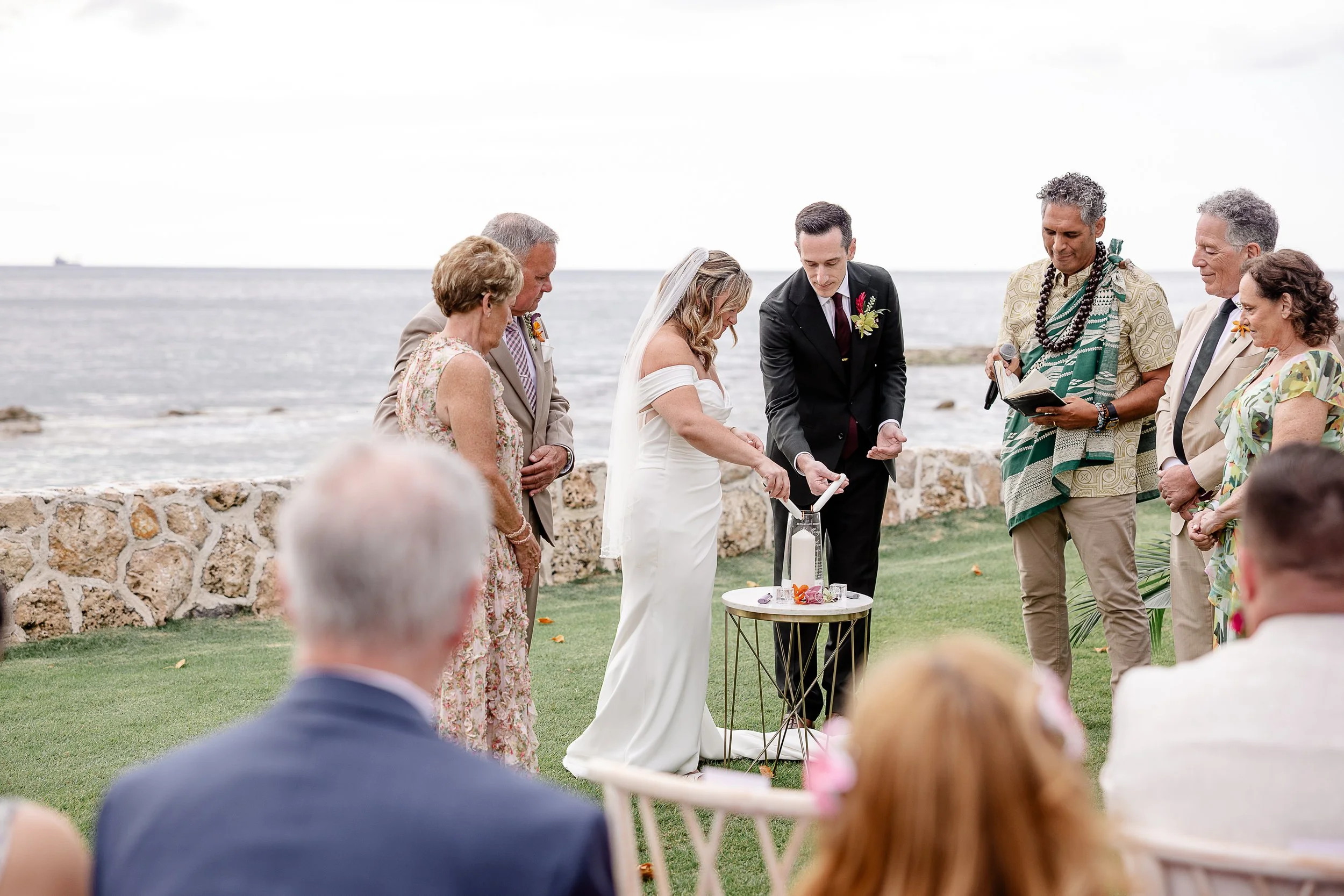 bride and groom lighting unity candle at ceremony in Hawai'i
