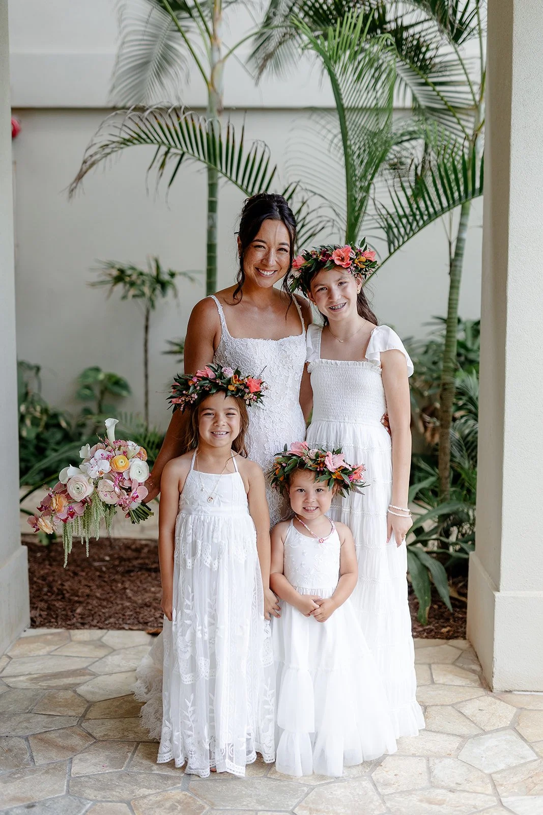 bride with flower girls wearing lei po'o