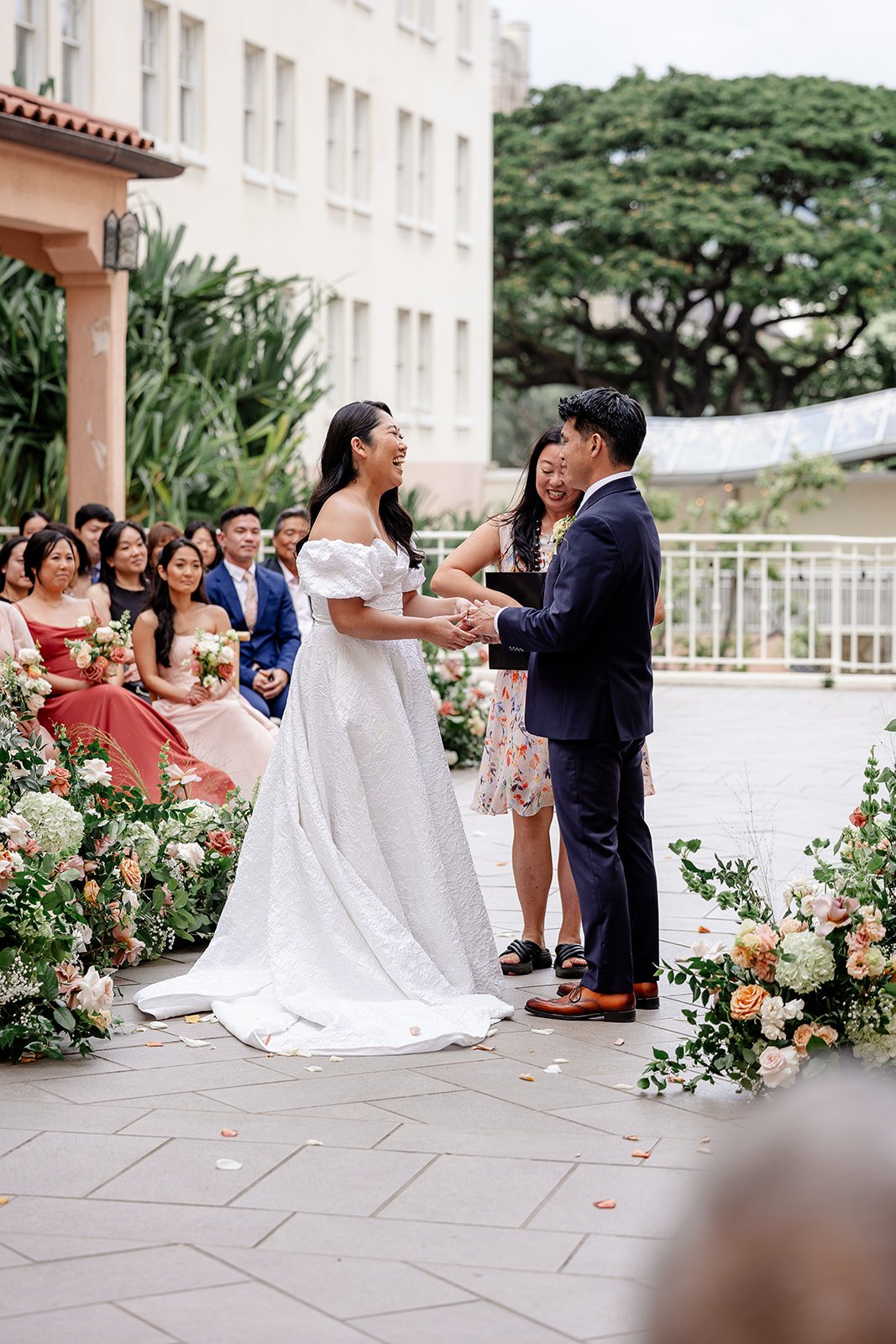 bride and groom laughing during wedding ceremony