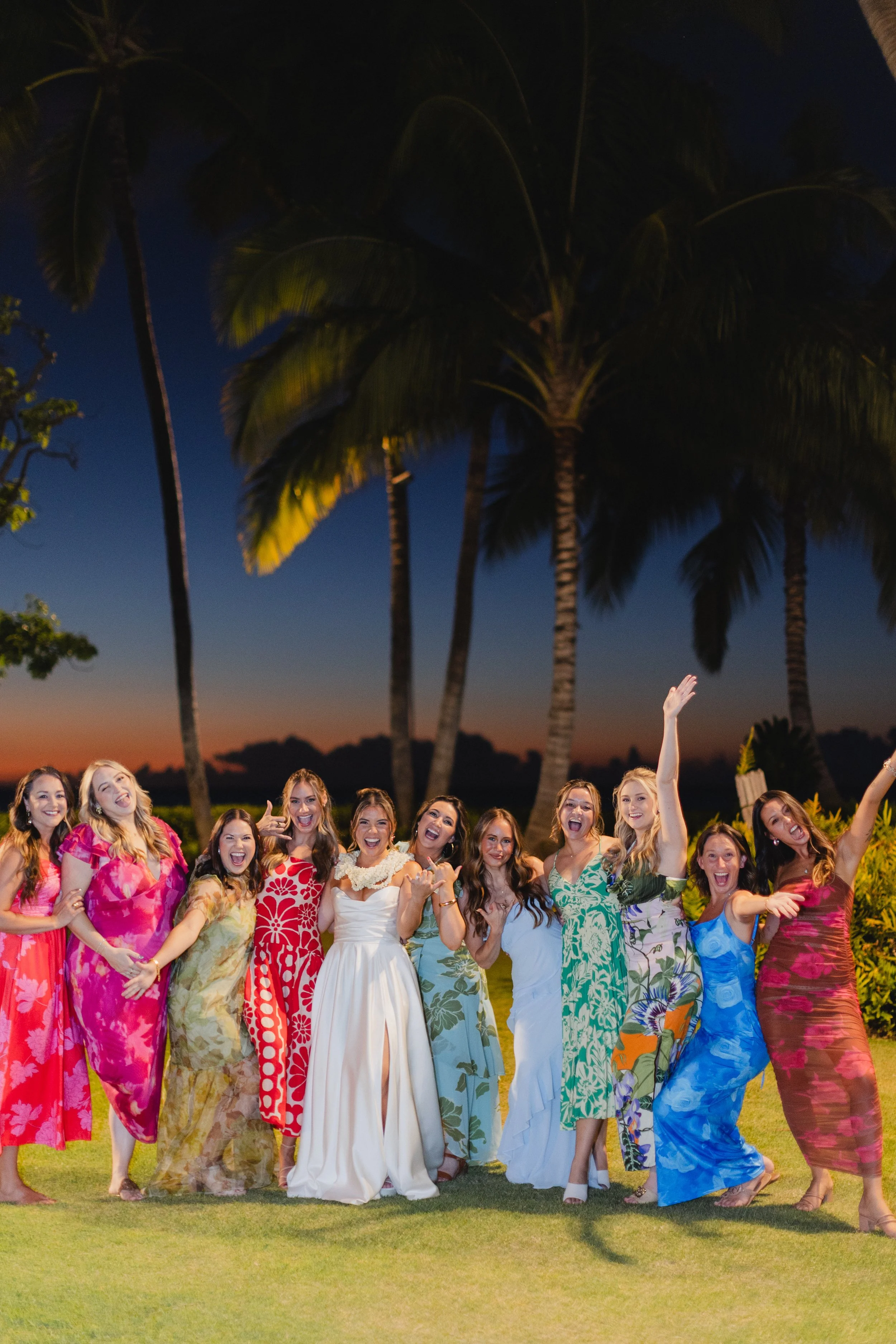 bride with bridesmaids with colorful tropical dresses