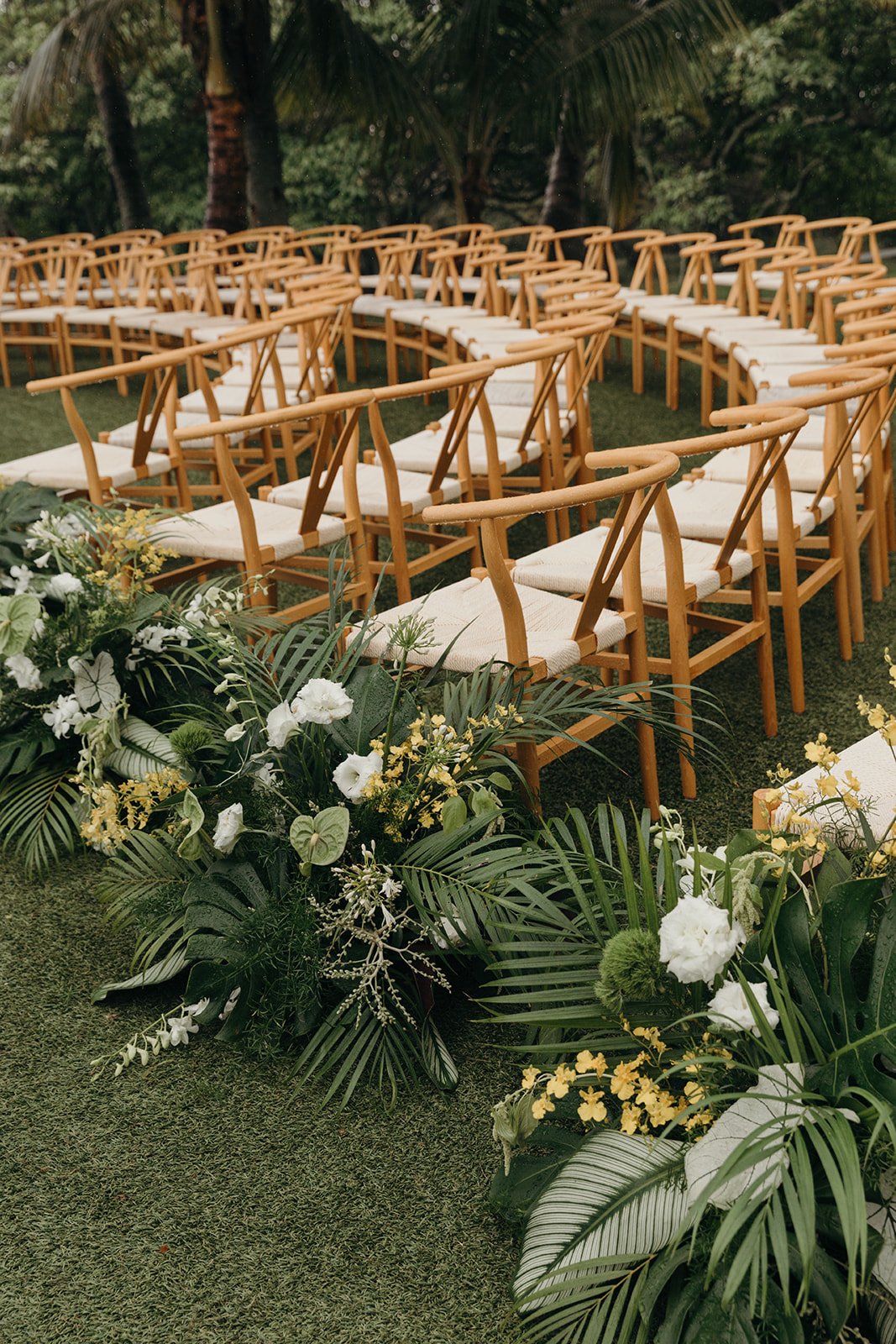 wedding ceremony in hawaii with white, yellow and green flowers