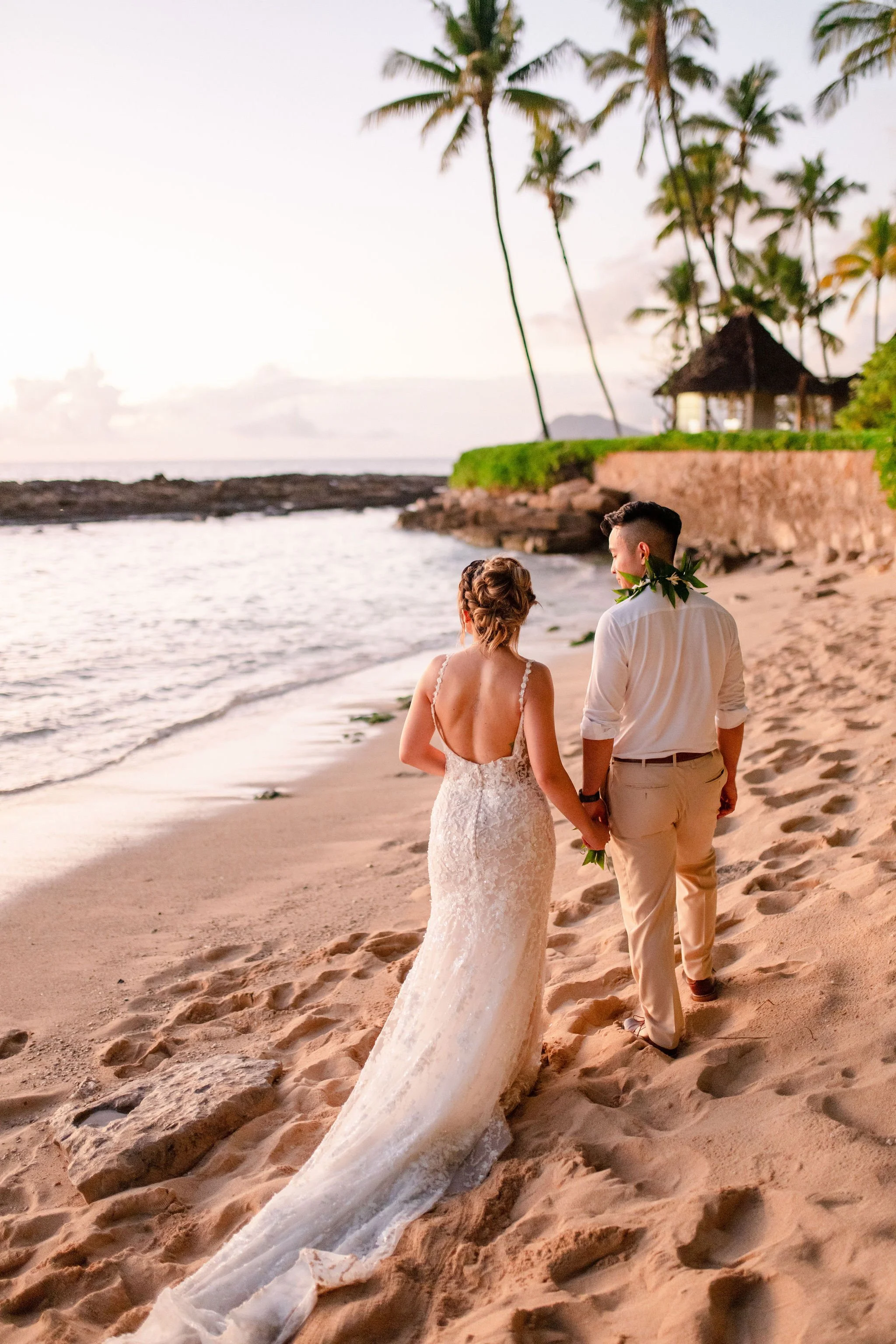 bride and groom on beach in hawaii