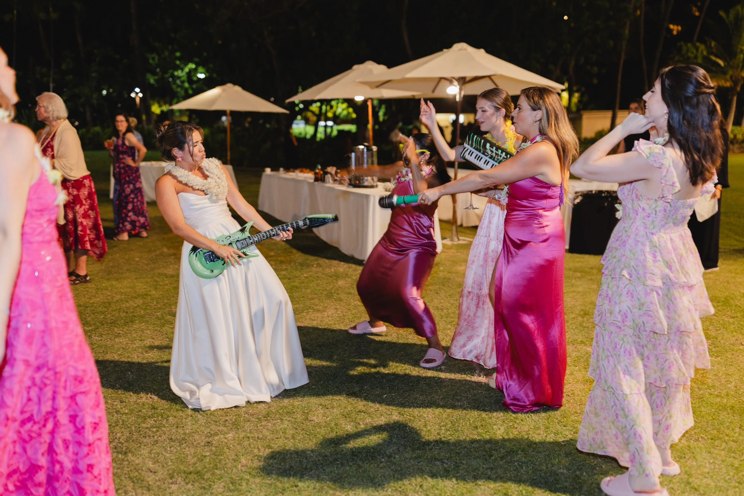 bride dancing with blow-up intruments