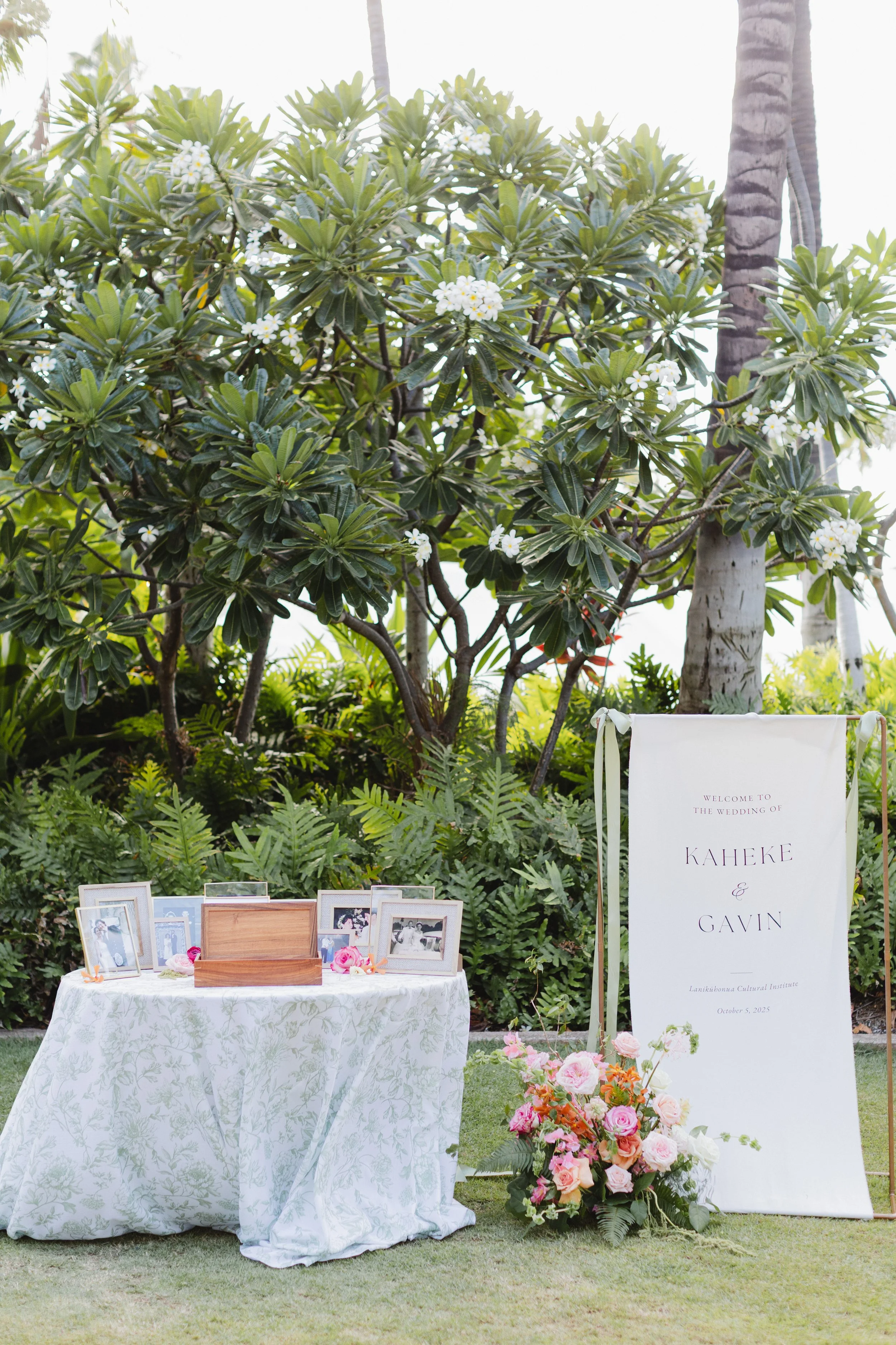 Wedding welcome area with pink and orange flowers