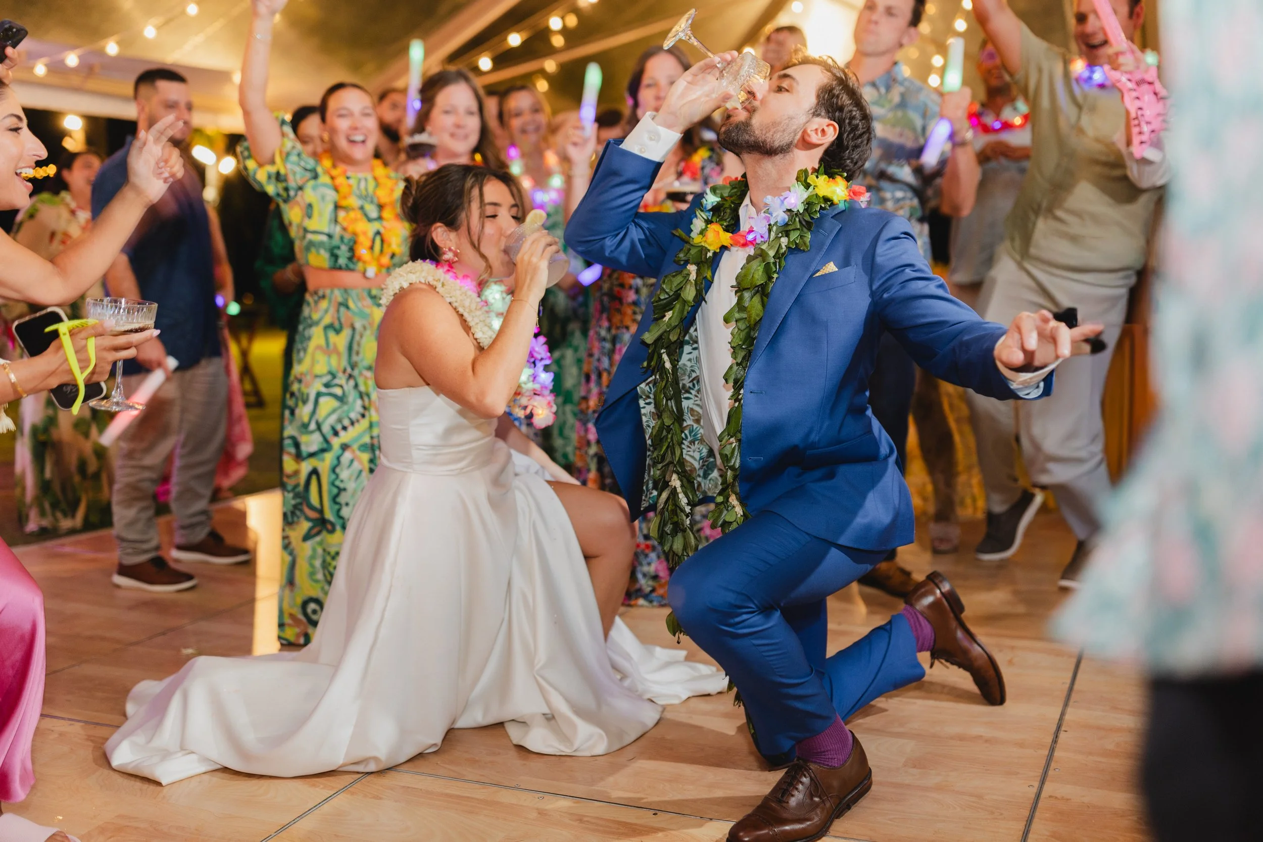 bride and groom drinking on the dance floor