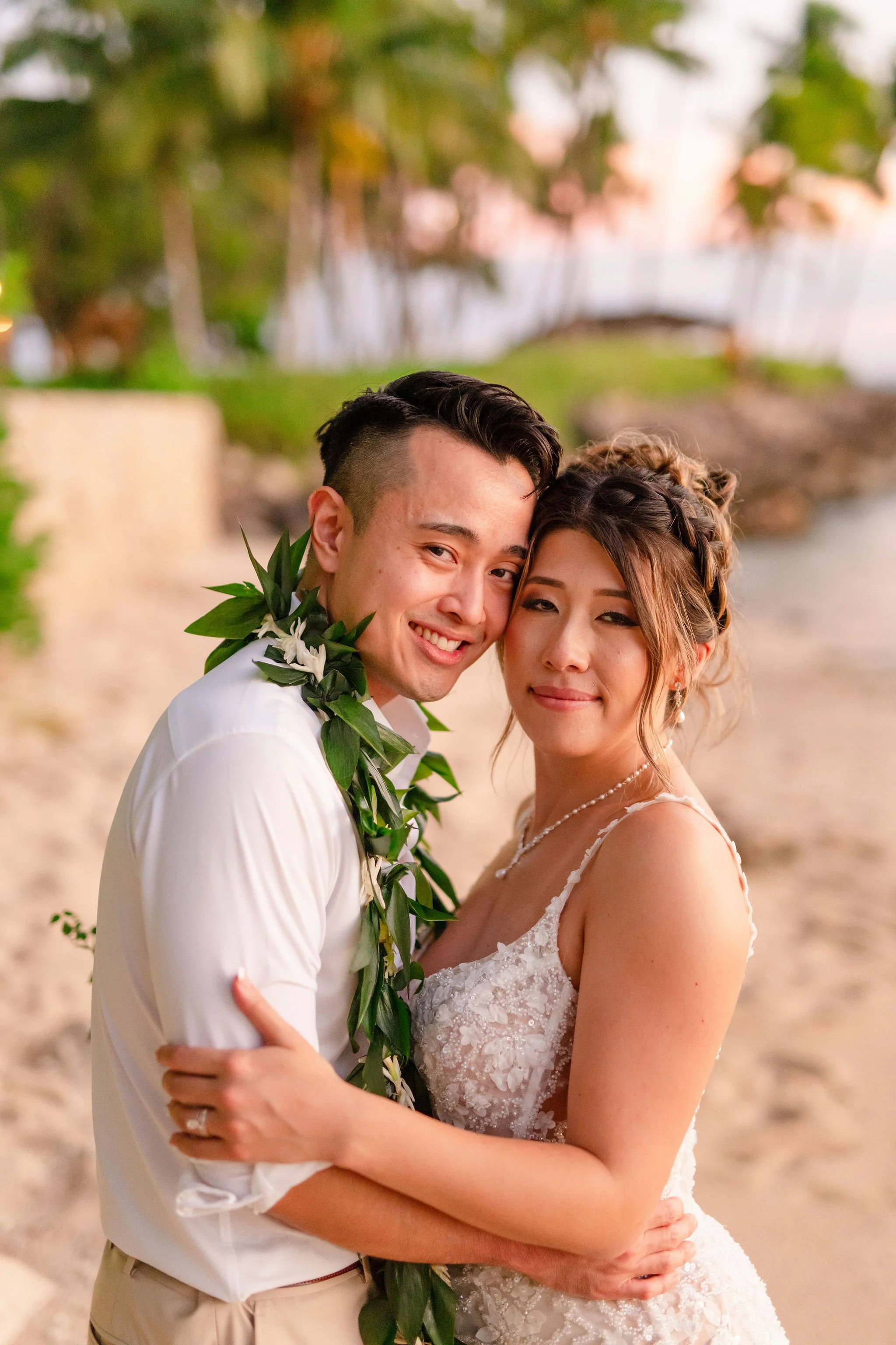 bride and groom on beach in Hawaii