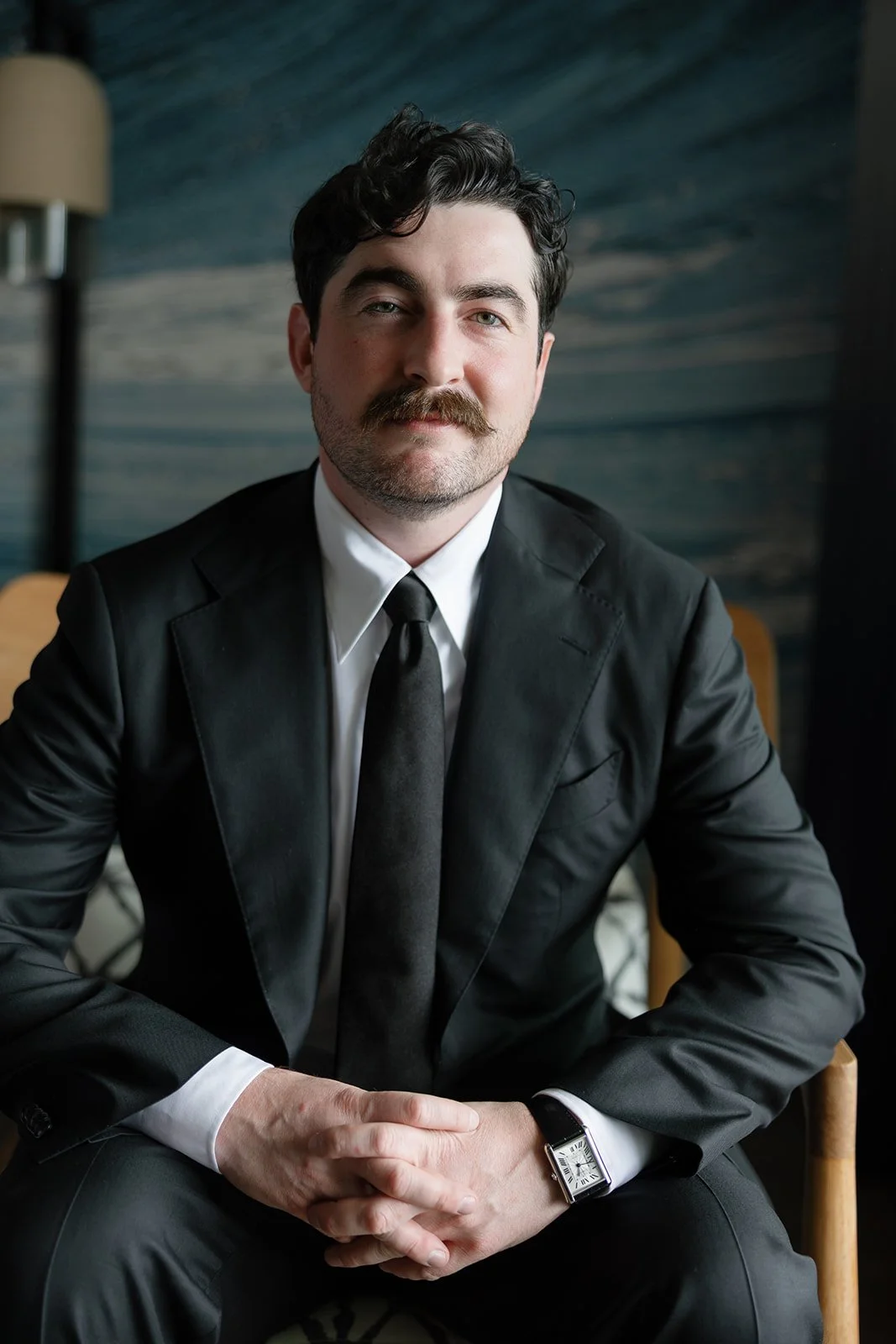 Groom in classic black suit at Paliku Gardens wedding, Hawaii wedding planner Love Letter Weddings
